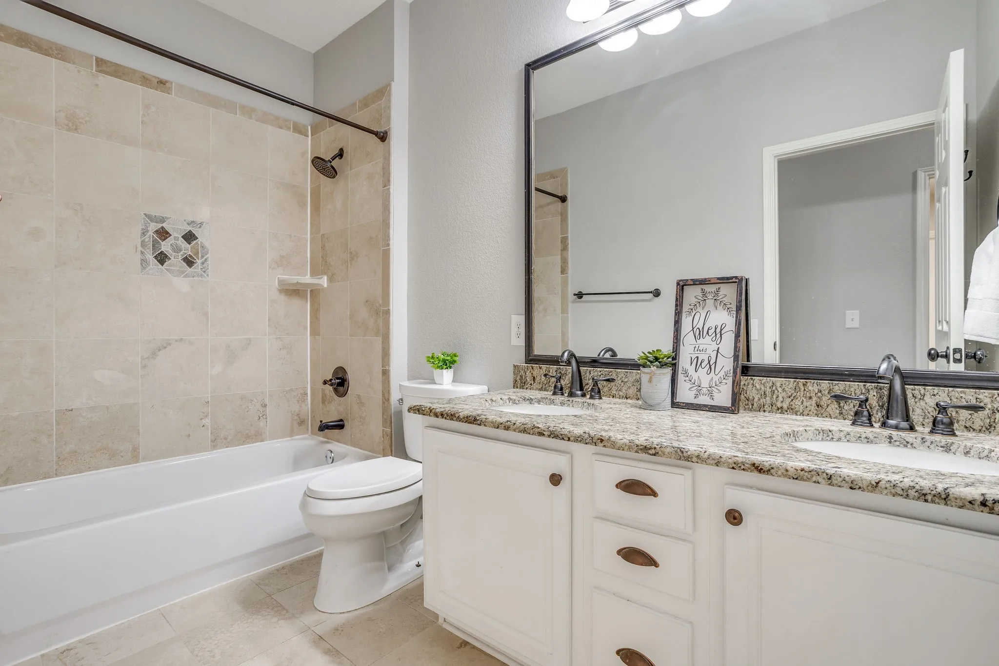 Dual vanity with granite countertops and undermount sinks