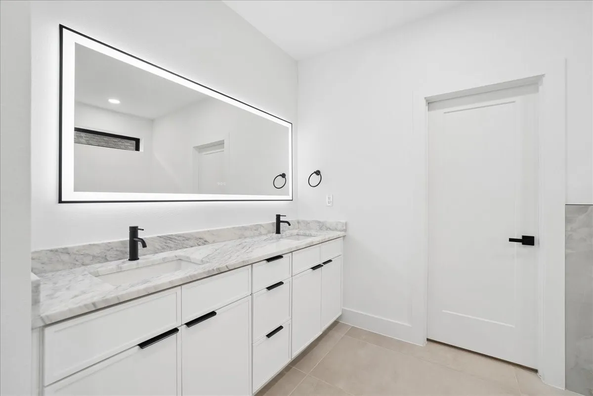 Dual vanity with integrated sinks and stone countertops