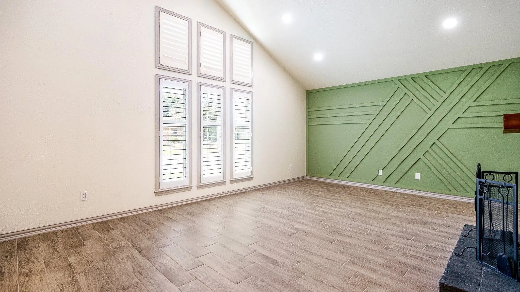 Vaulted ceilings, wood-finish flooring, and recessed lighting