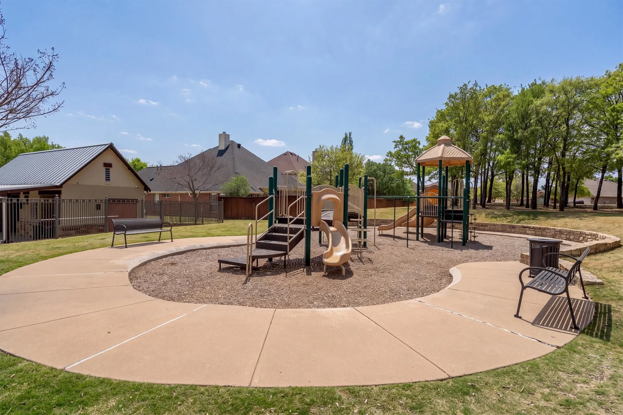 Community playground featuring multiple slides and climbing structures