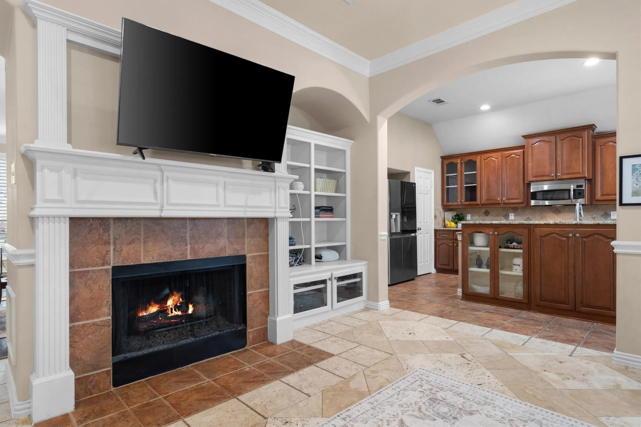 Central fireplace with a tile surround and a substantial mantel