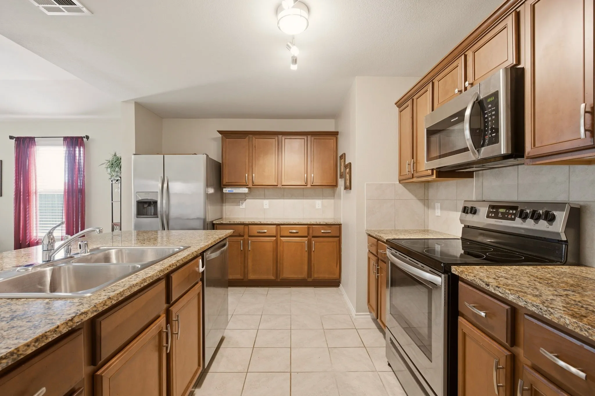 Like to cook? You'll love the size of this very workable kitchen. All appliances convey, including the refrigerator, + it has awesome cabinet storage.