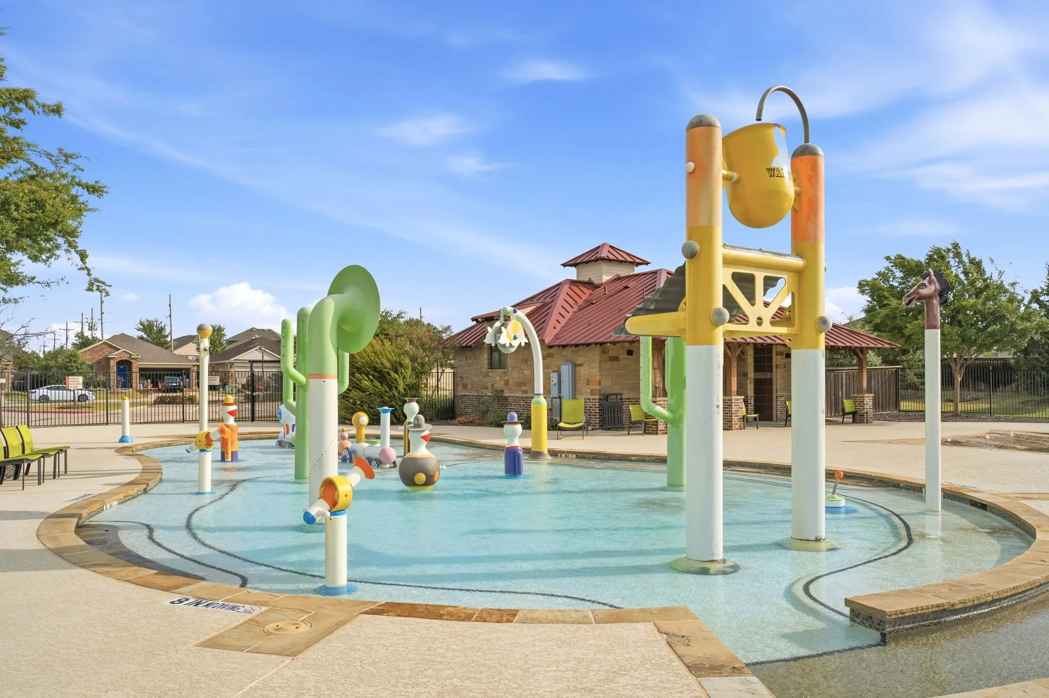 A splash pad area for the little ones is a popular community amenity.