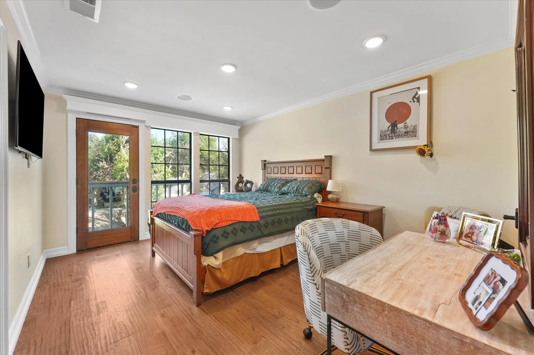 Upstairs bedroom with a walk-in closet and greenbelt views.