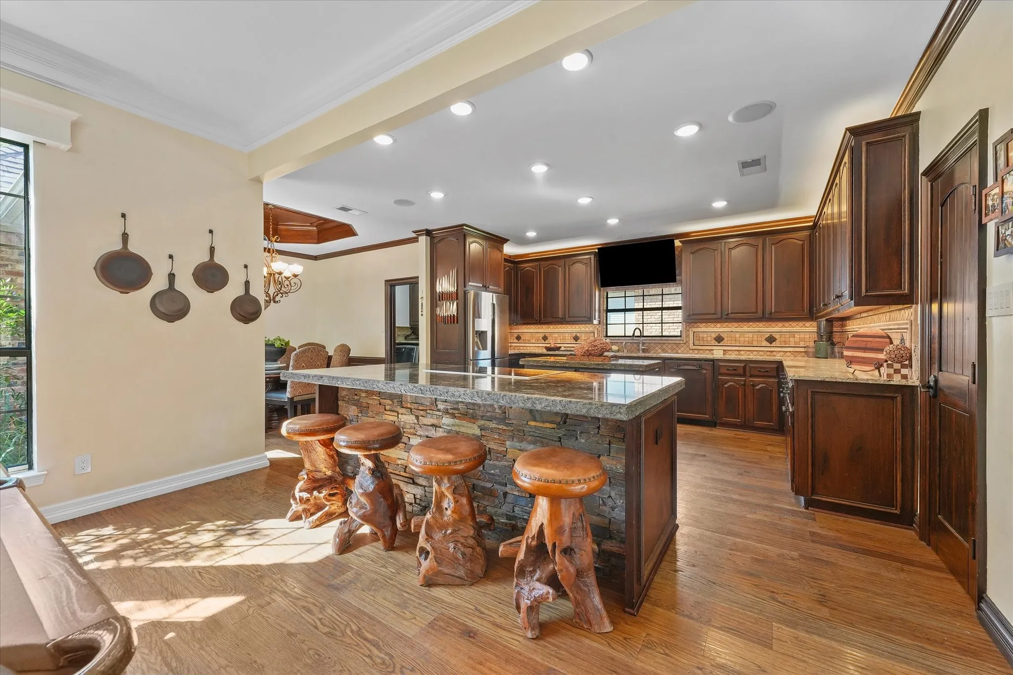 Chef’s kitchen with two custom islands, chiseled-edge granite and extensive custom cabinetry.
