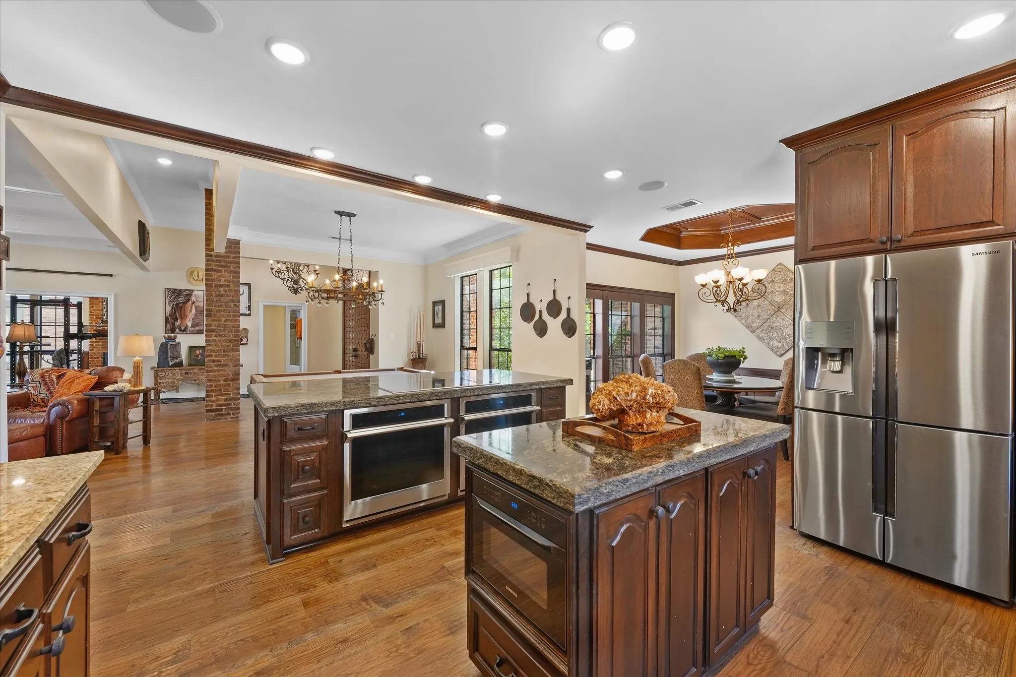 An induction cooktop, double ovens and a walk-in pantry support everyday cooking and entertaining.