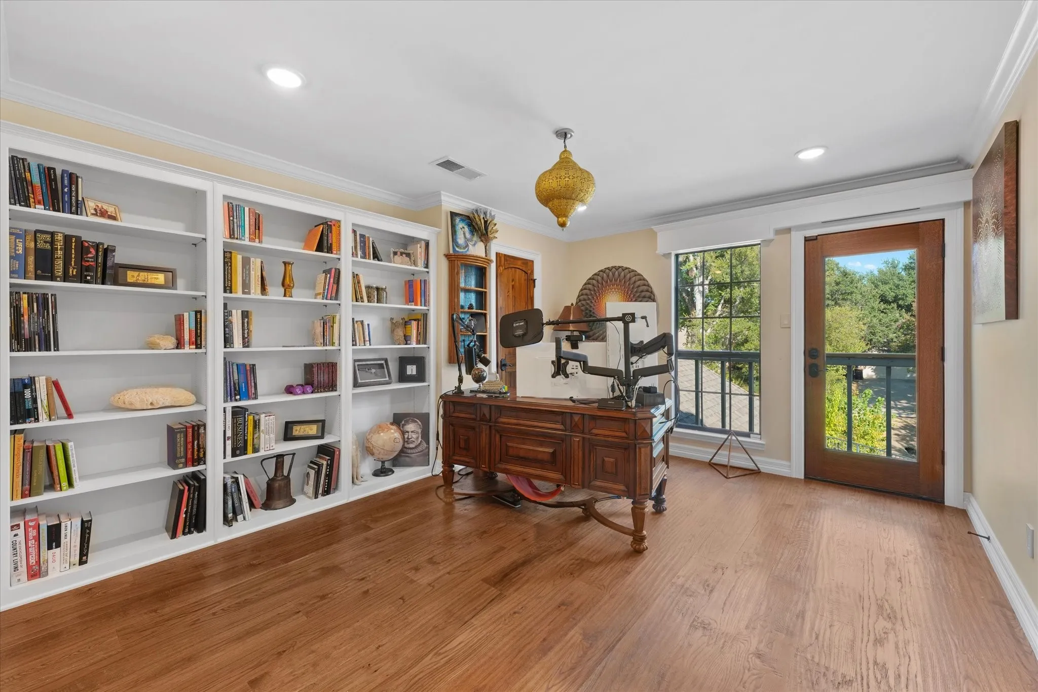 Second upstairs bedroom, currently used as an office, with a walk-in closet and greenbelt views.