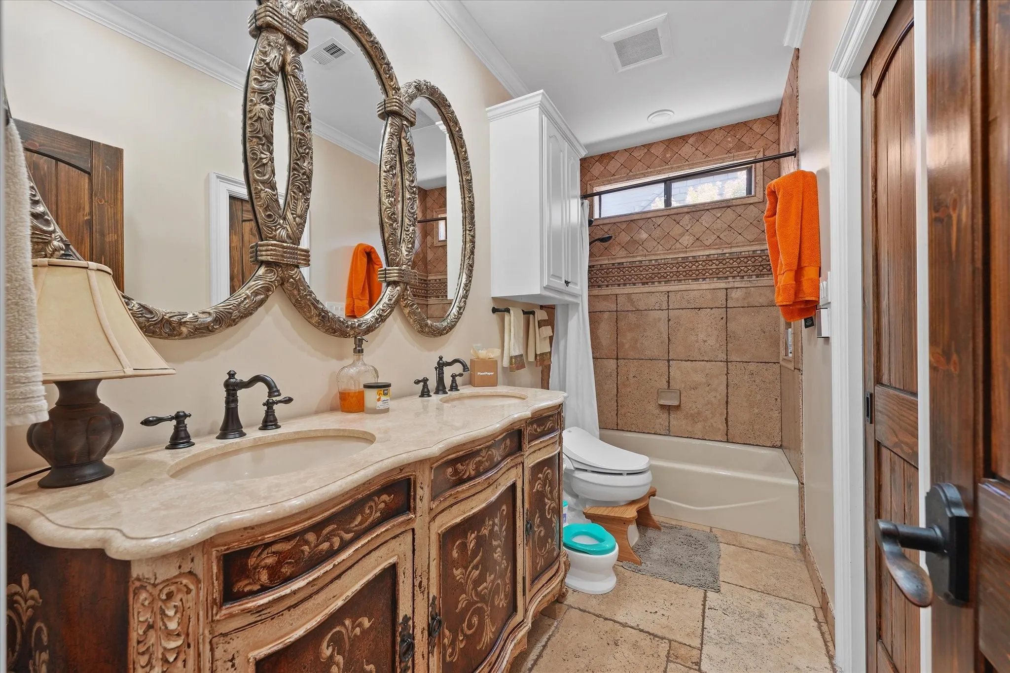This full bath connects to the second downstairs bedroom and also serves the main level.