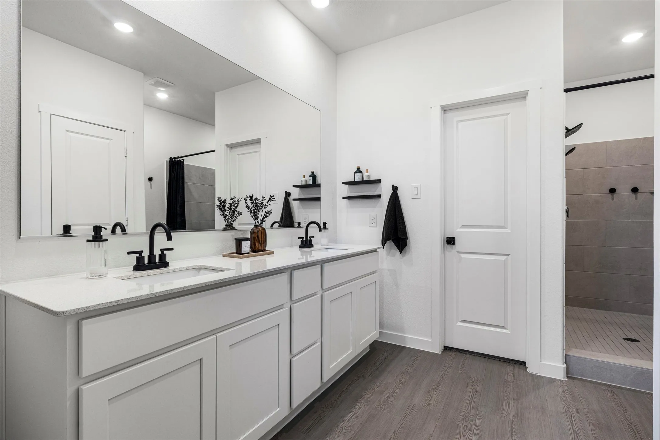 Dual vanity with white cabinetry and integrated sinks