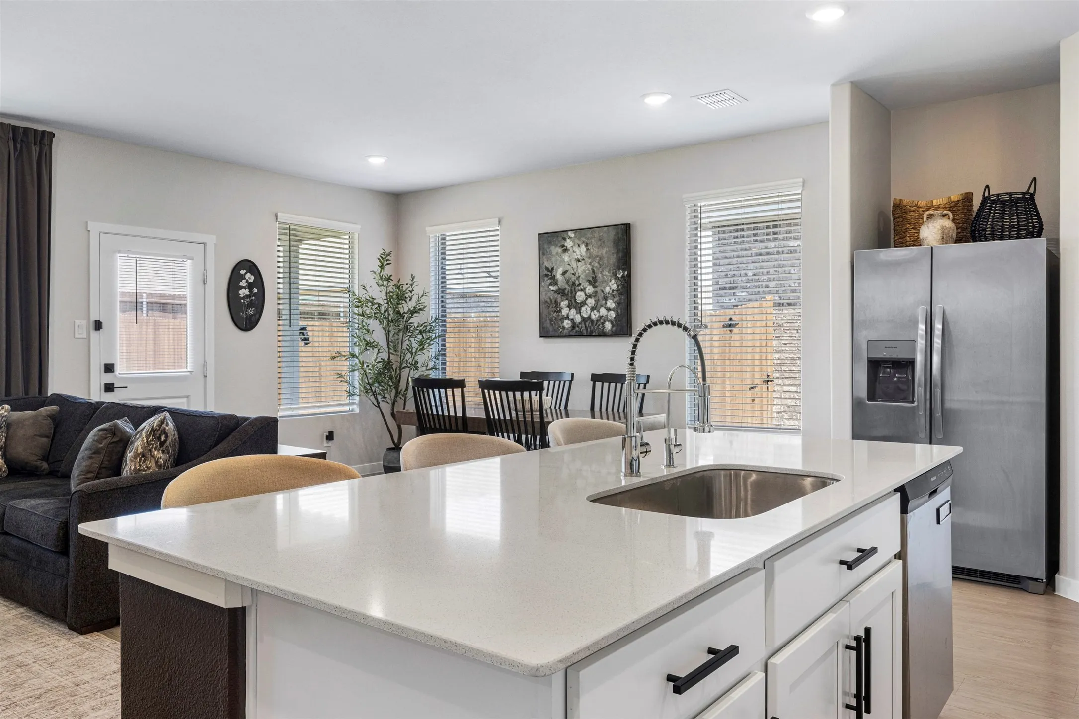 Kitchen island with an undermount sink and gooseneck faucet