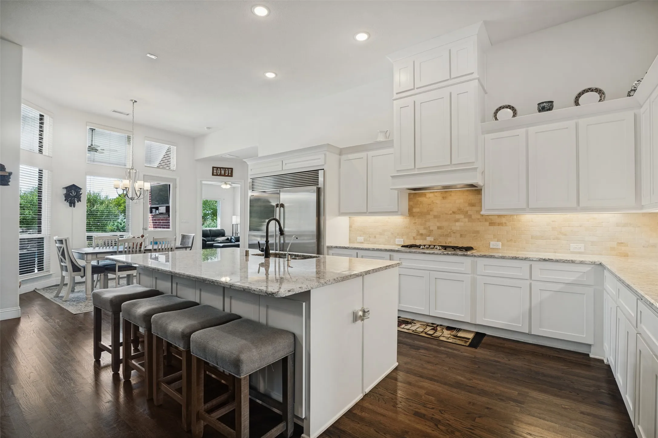 Kitchen with large island, gas cooktop and tons of kitchen cabinets