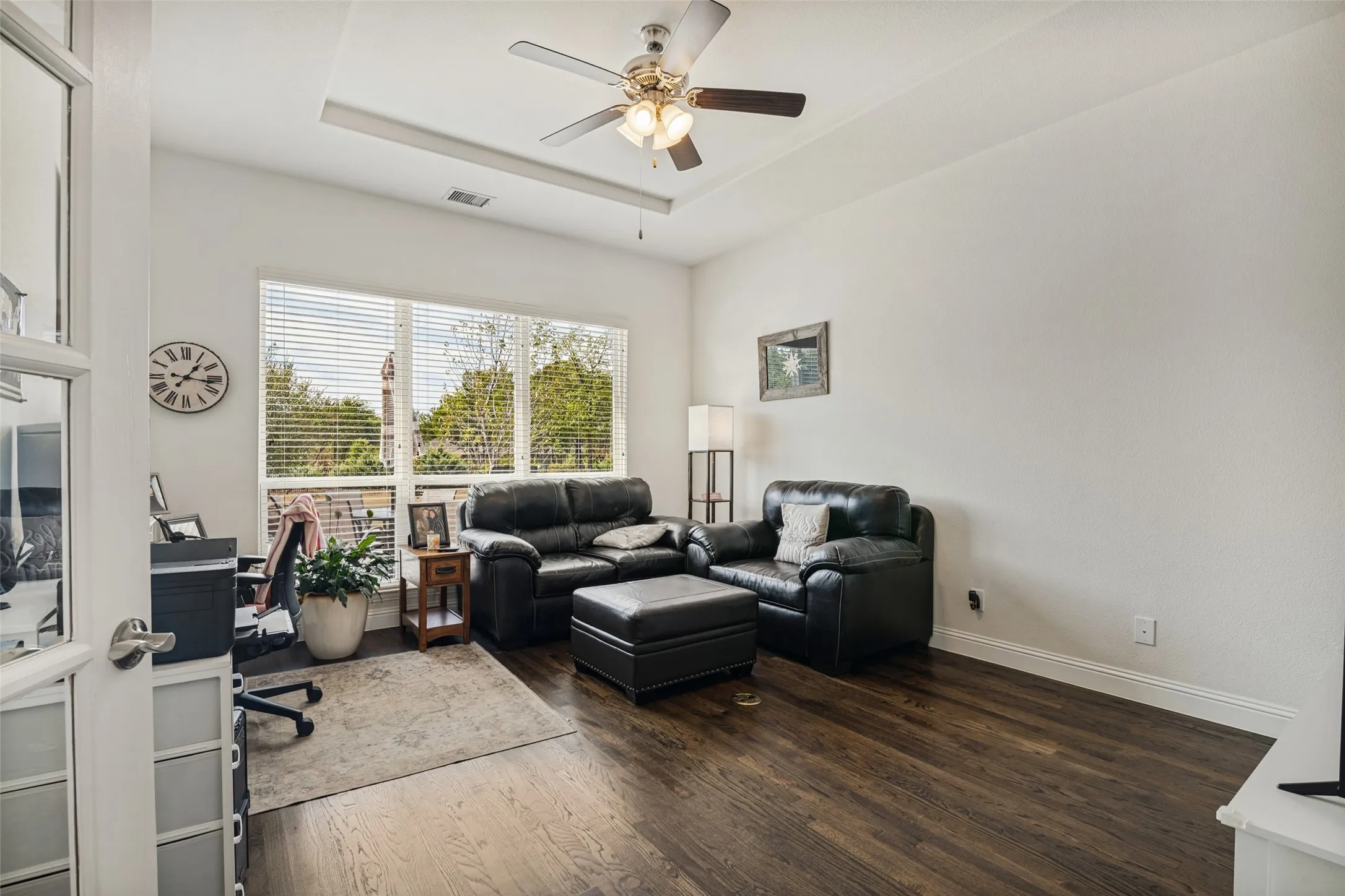 Office can be playroom or TV room overlooking pool area with huge back yard.  Pop up ceiling with ceiling fan and hardwood floors