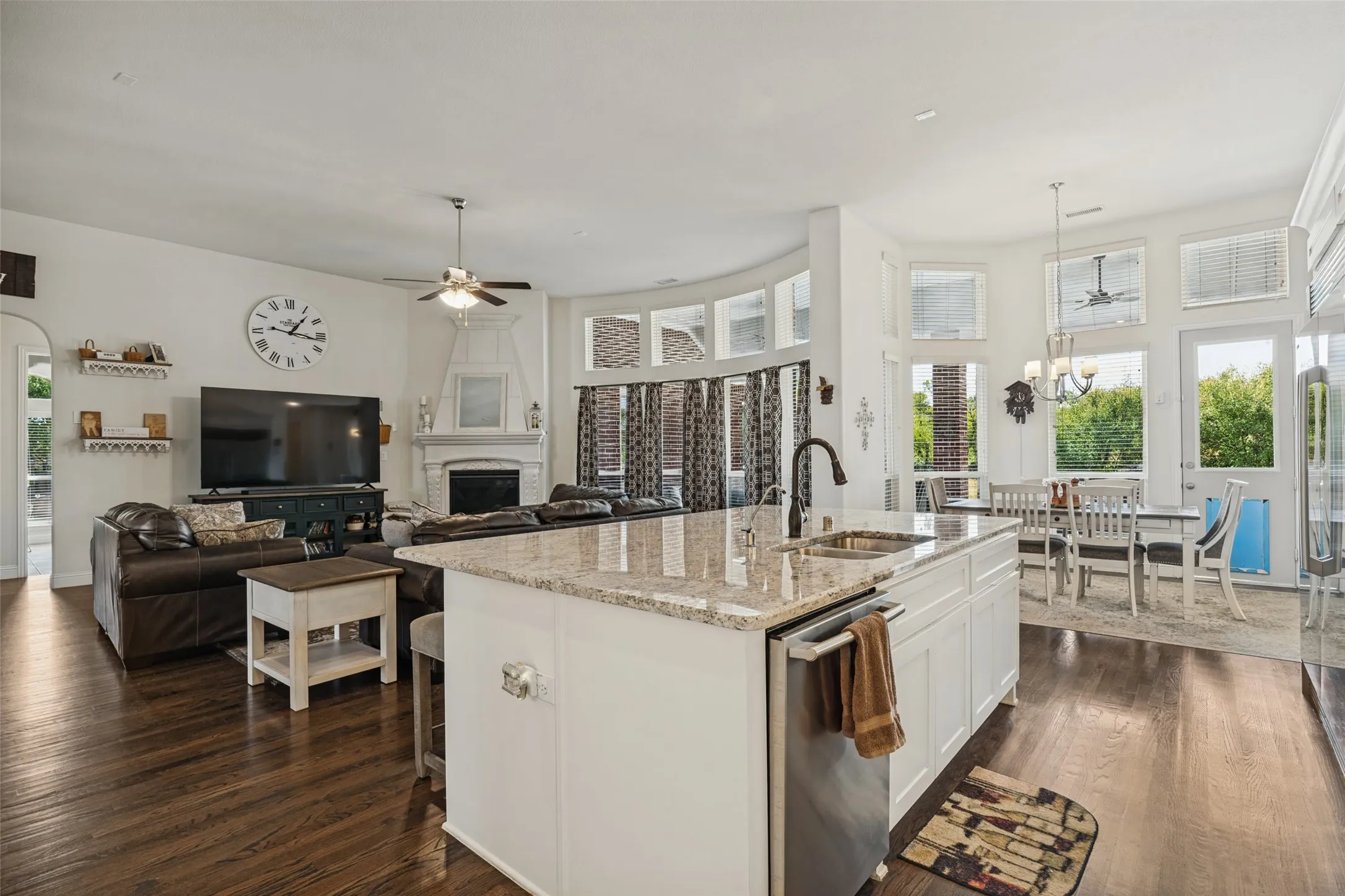 Big kitchen island with granite countertops and large breakfast bar.