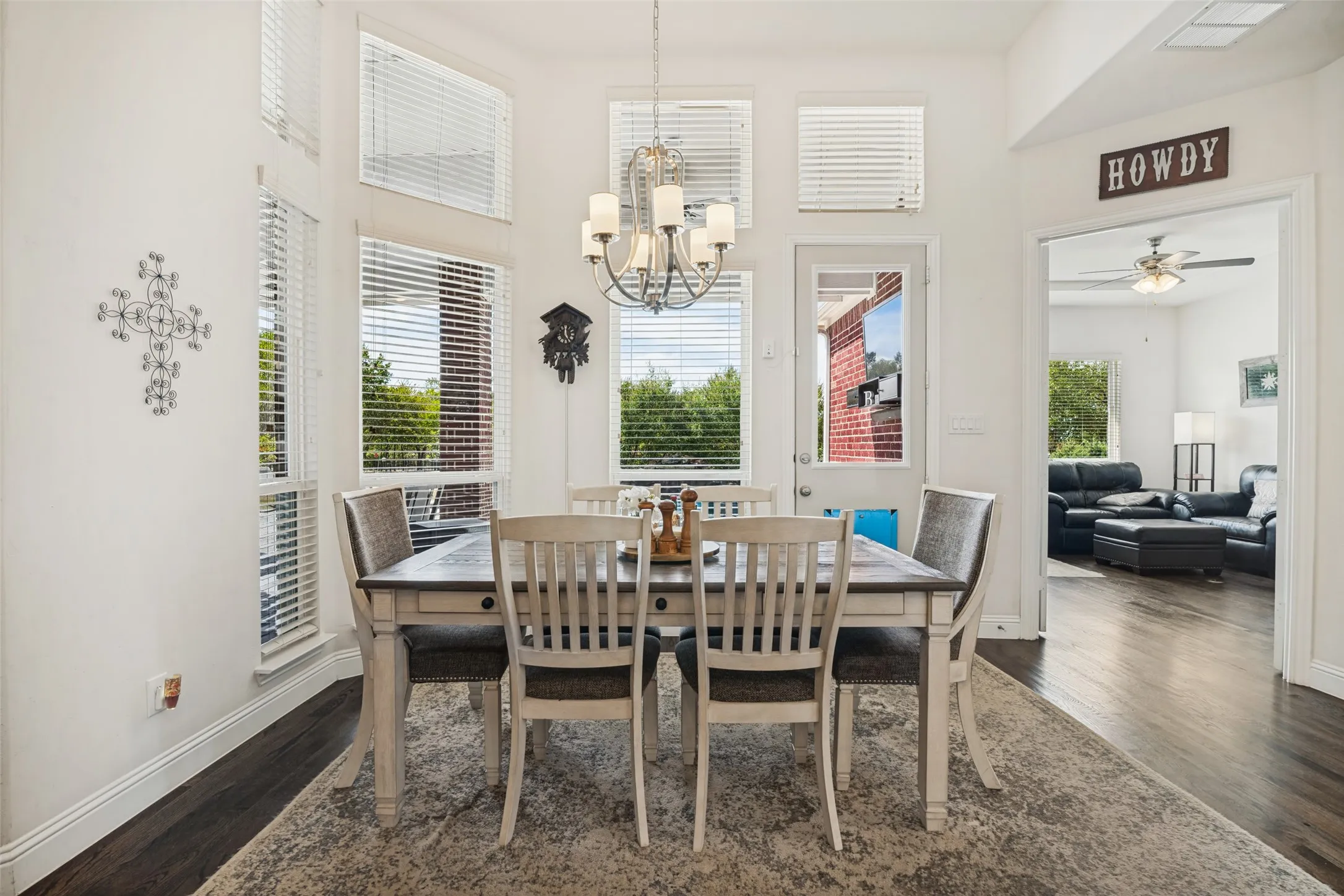 Nice size breakfast room with chandelier, hardwood floors overlooking back patio.