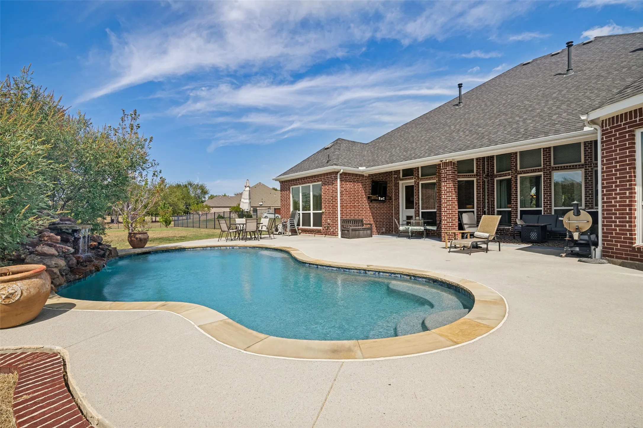 Covered patio with pool and large patio, great space for entertaining.