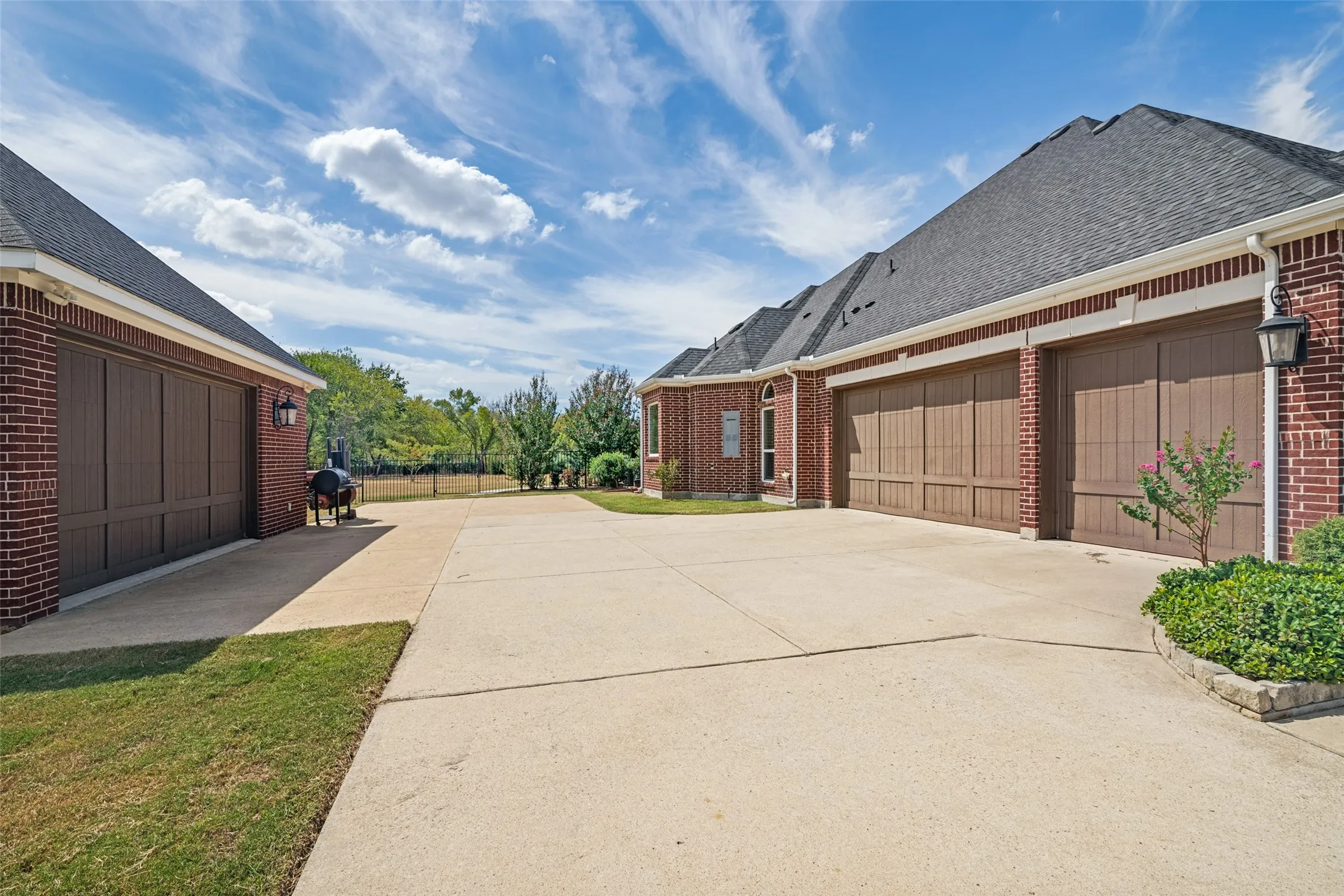 3 car garage attached and 2 1/2 detached car garage.