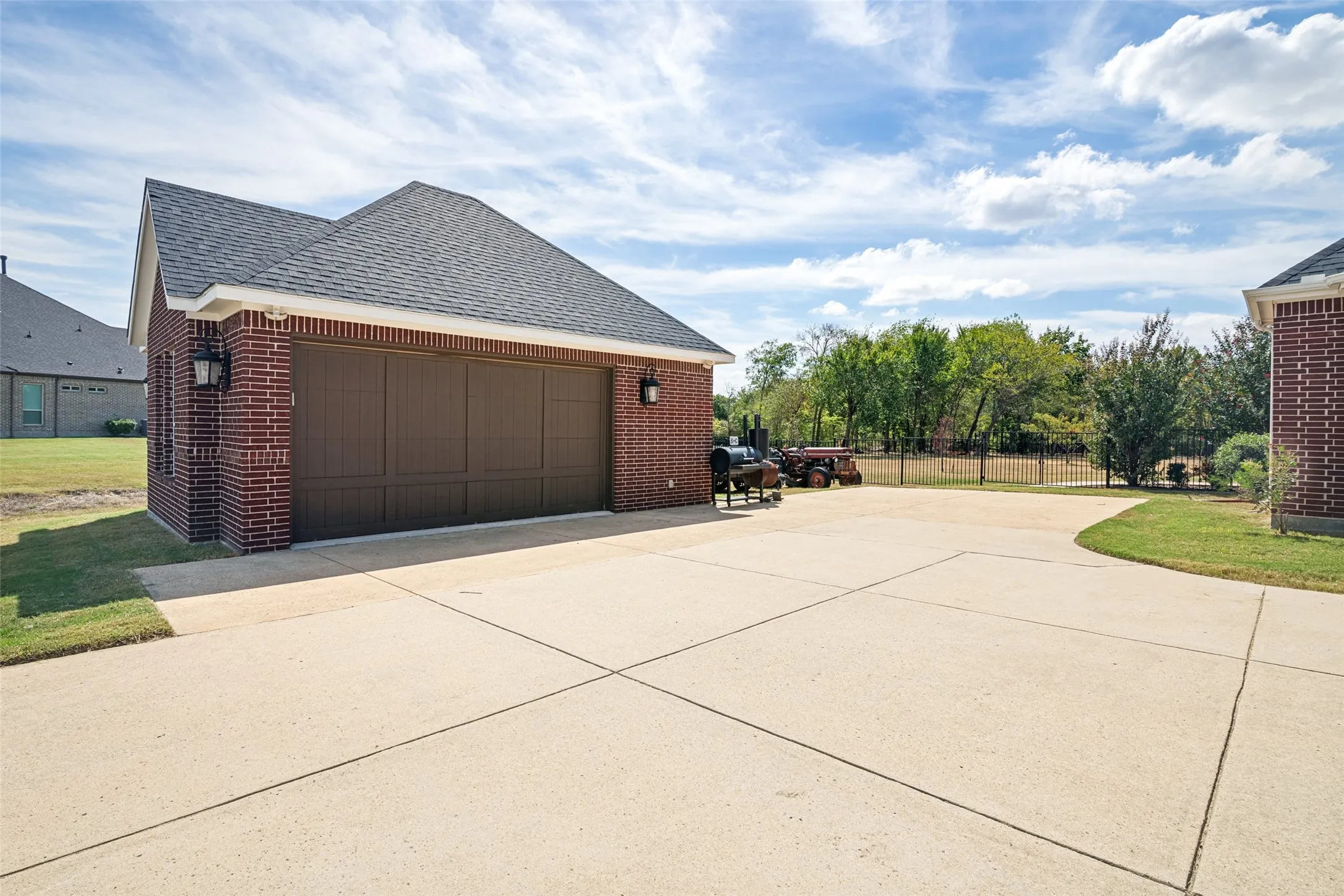 Detached 2 1/2 car garage with large side yard behind.