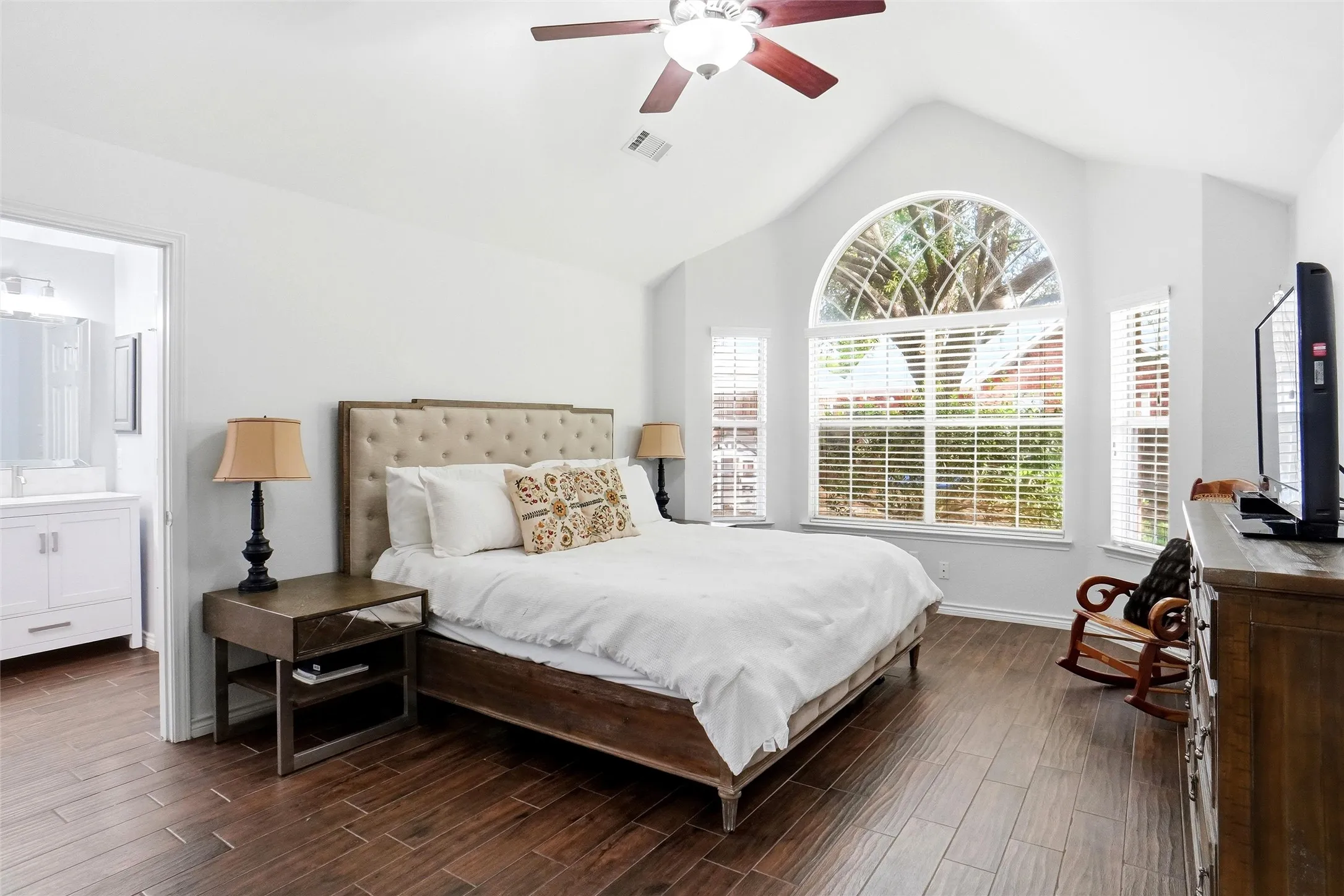 Primary bedroom, very spacious with vaulted ceiling and fans.