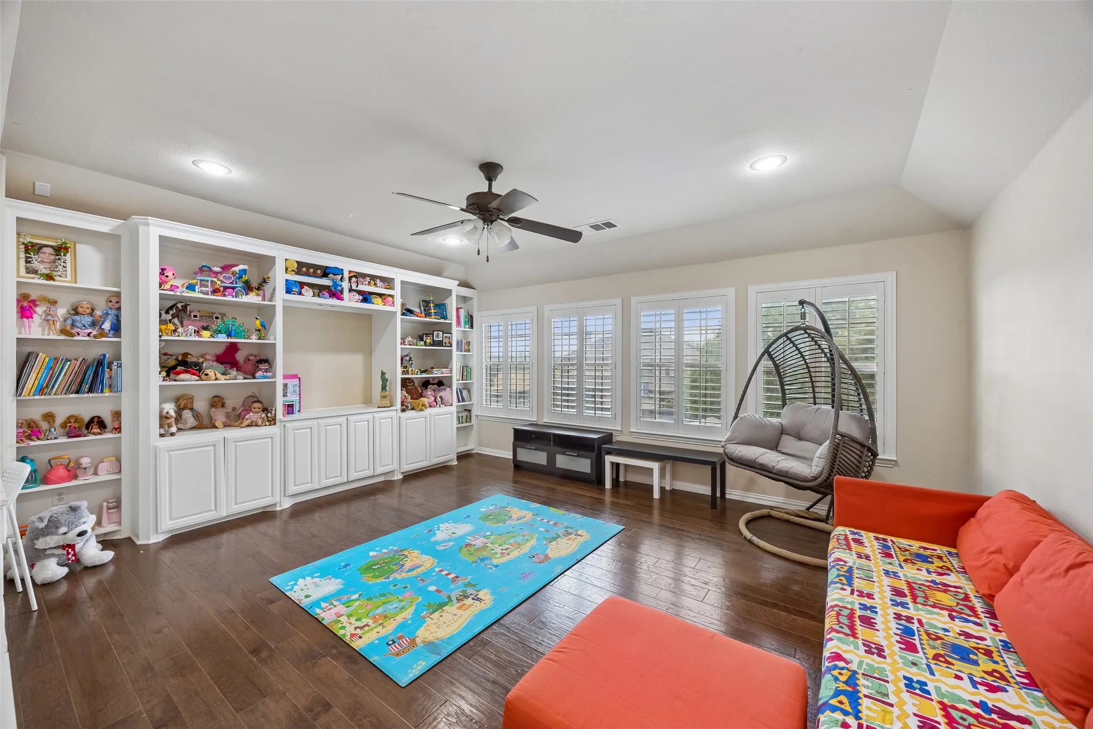 Room featuring wood-finish flooring, recessed lighting, and a ceiling fan