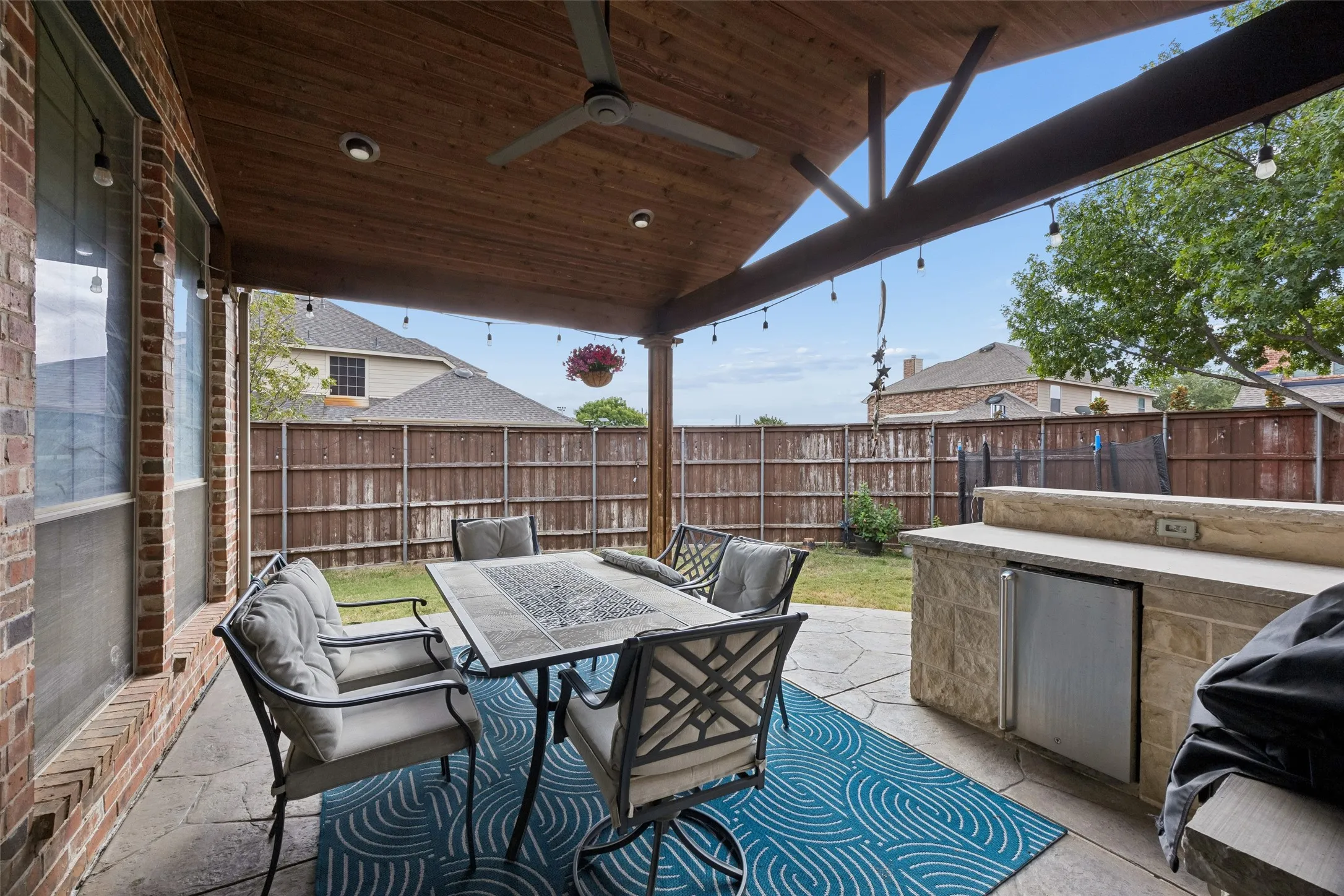 Covered patio featuring a wood-finish ceiling, recessed lighting, and an outdoor fan