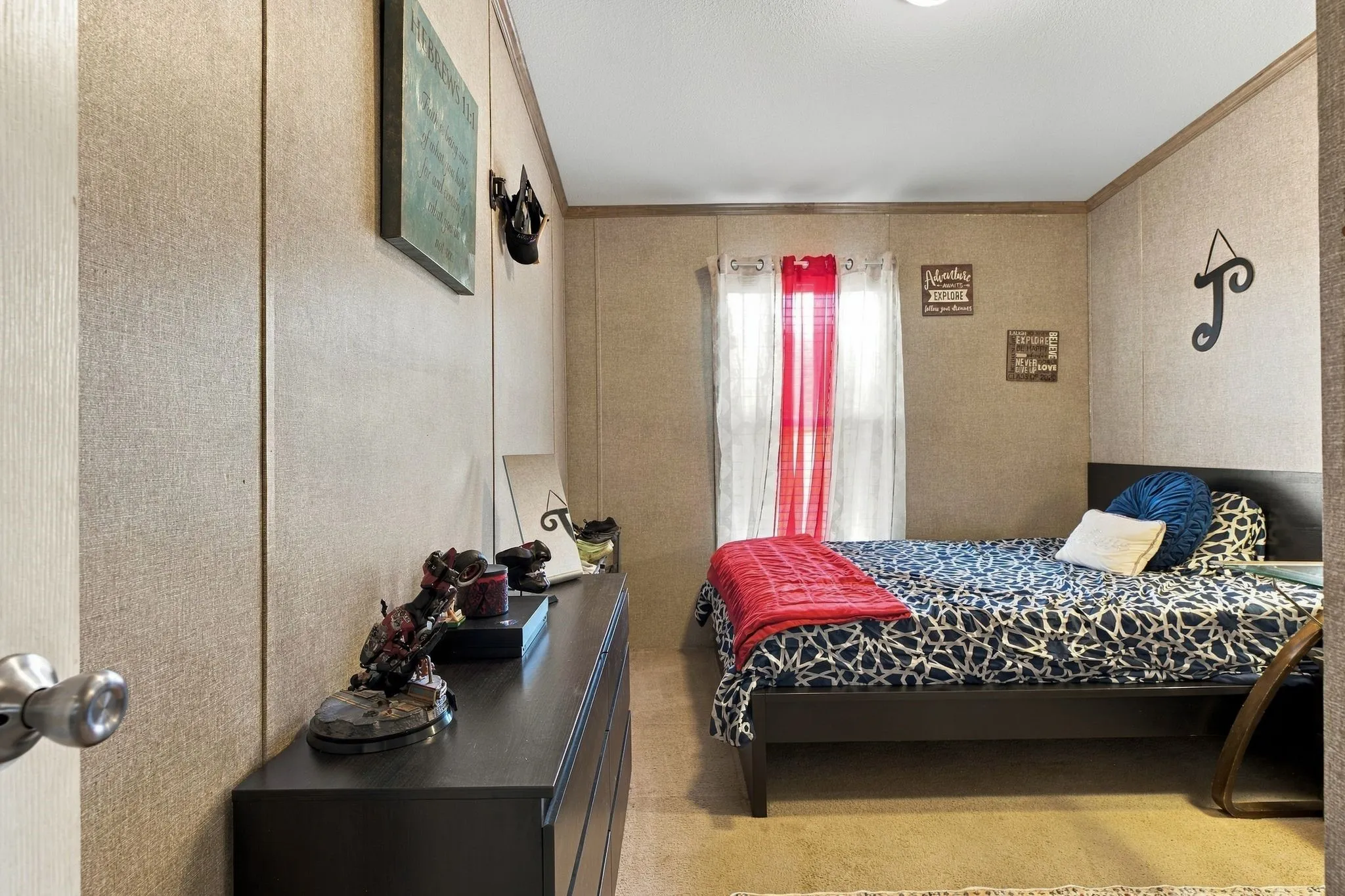 Neutral wall finishes, recessed lighting, and a window with natural light
