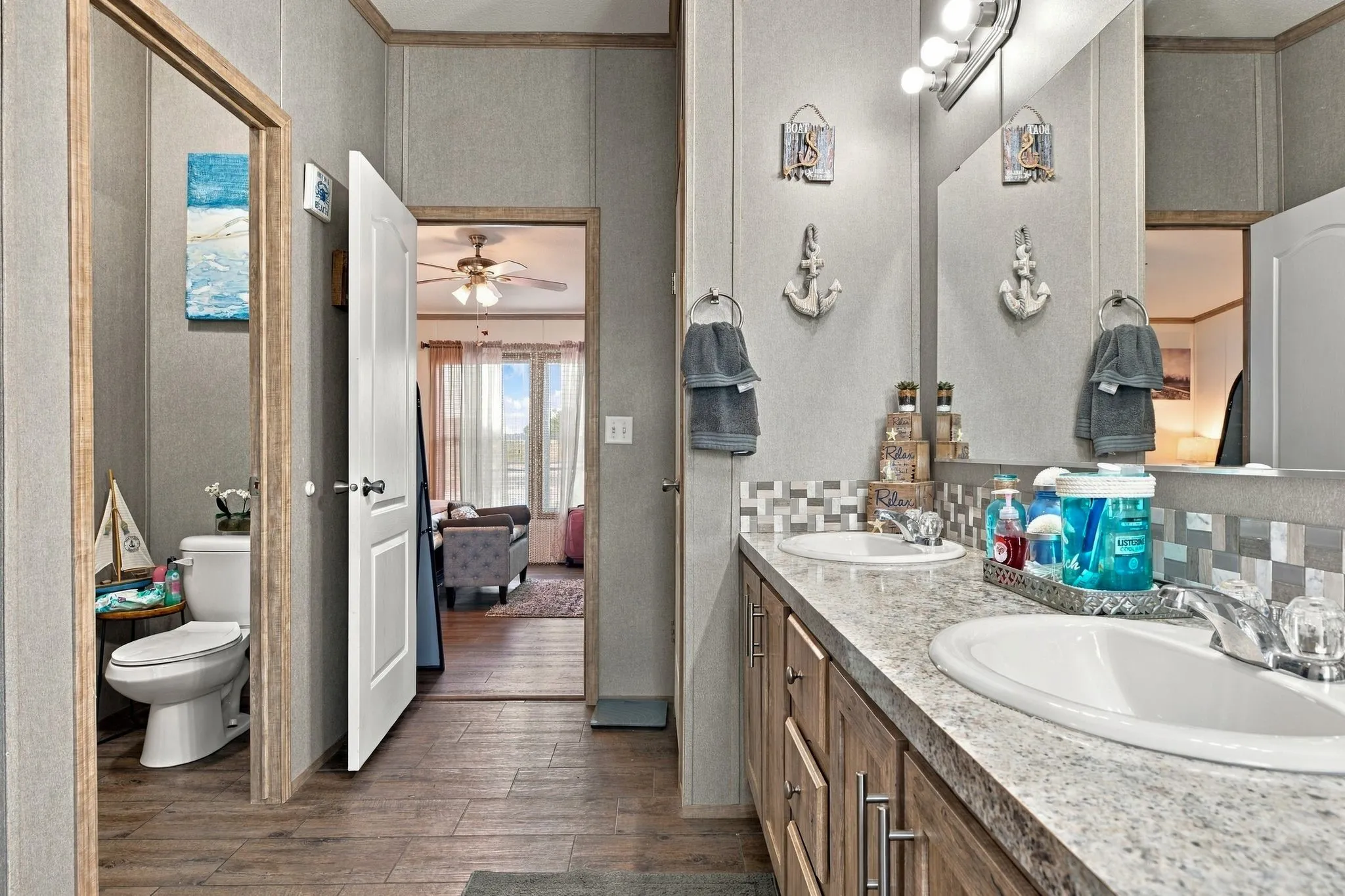 Double vanity featuring integrated sinks and a speckled countertop