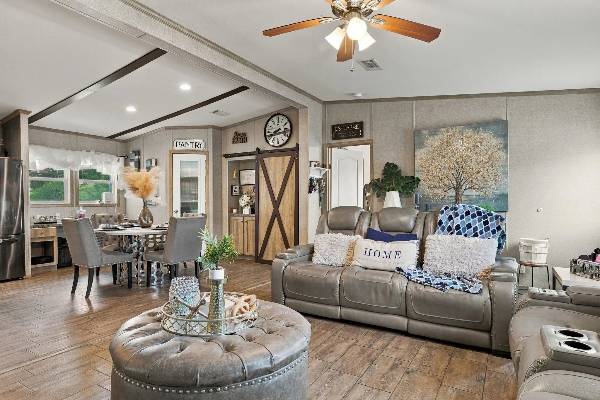 Open-concept living space with wood-finish flooring