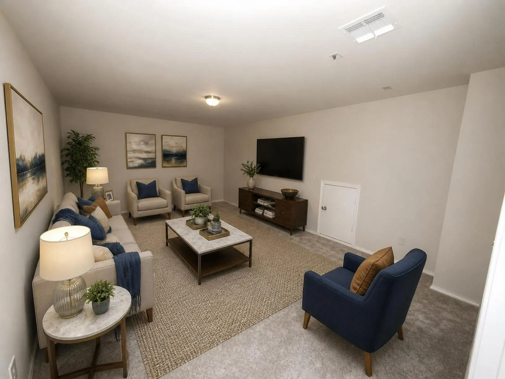 Wall-to-wall carpeting with a central area rug, light-colored walls, and recessed lighting