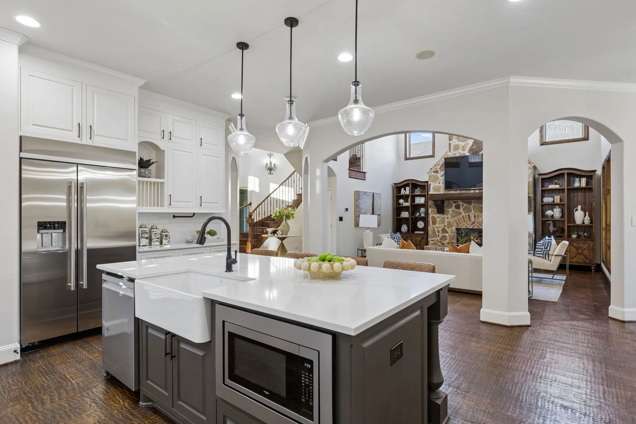 Large fully upgraded open concept kitchen looking out into the living room