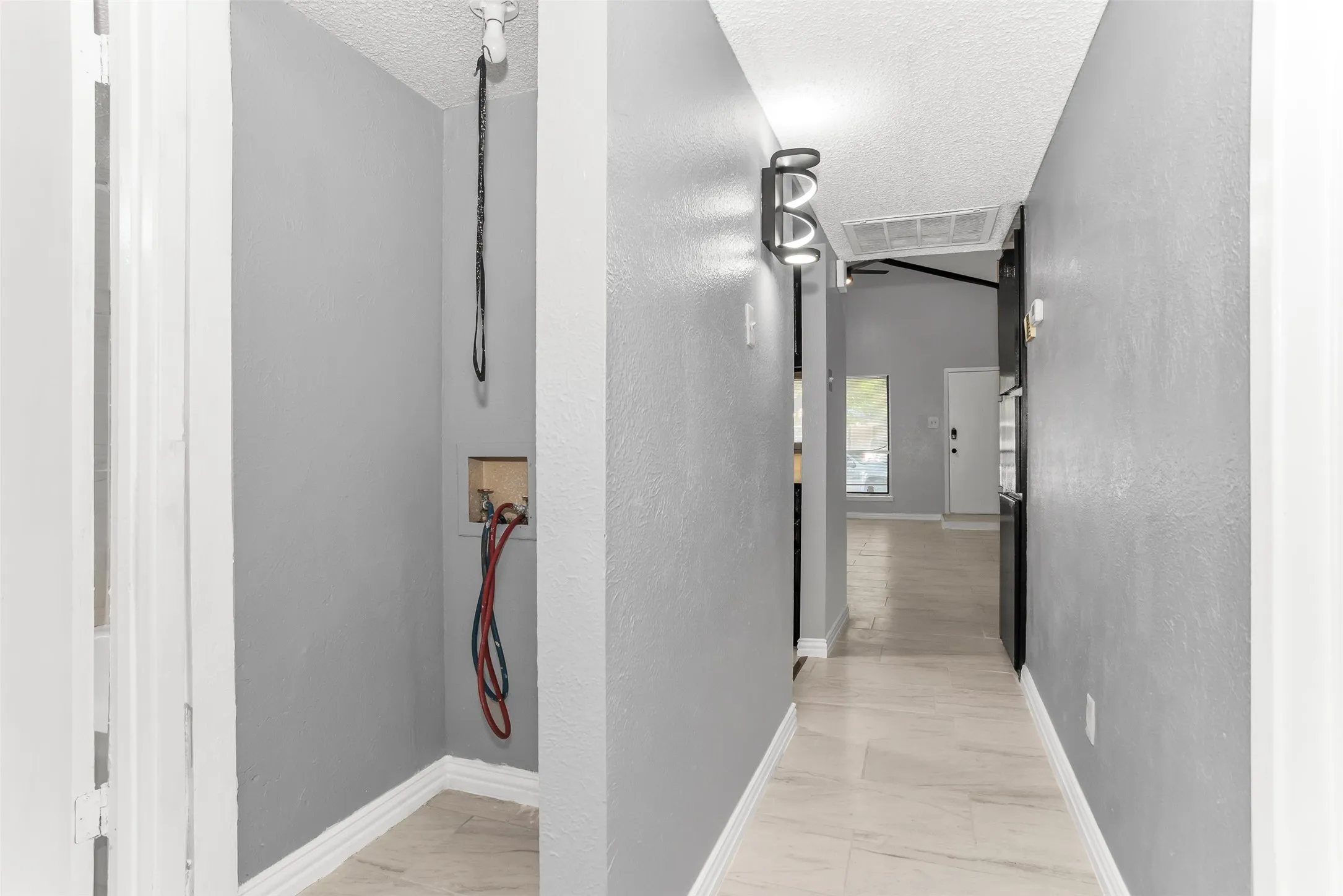 Neutral-toned tile flooring throughout
