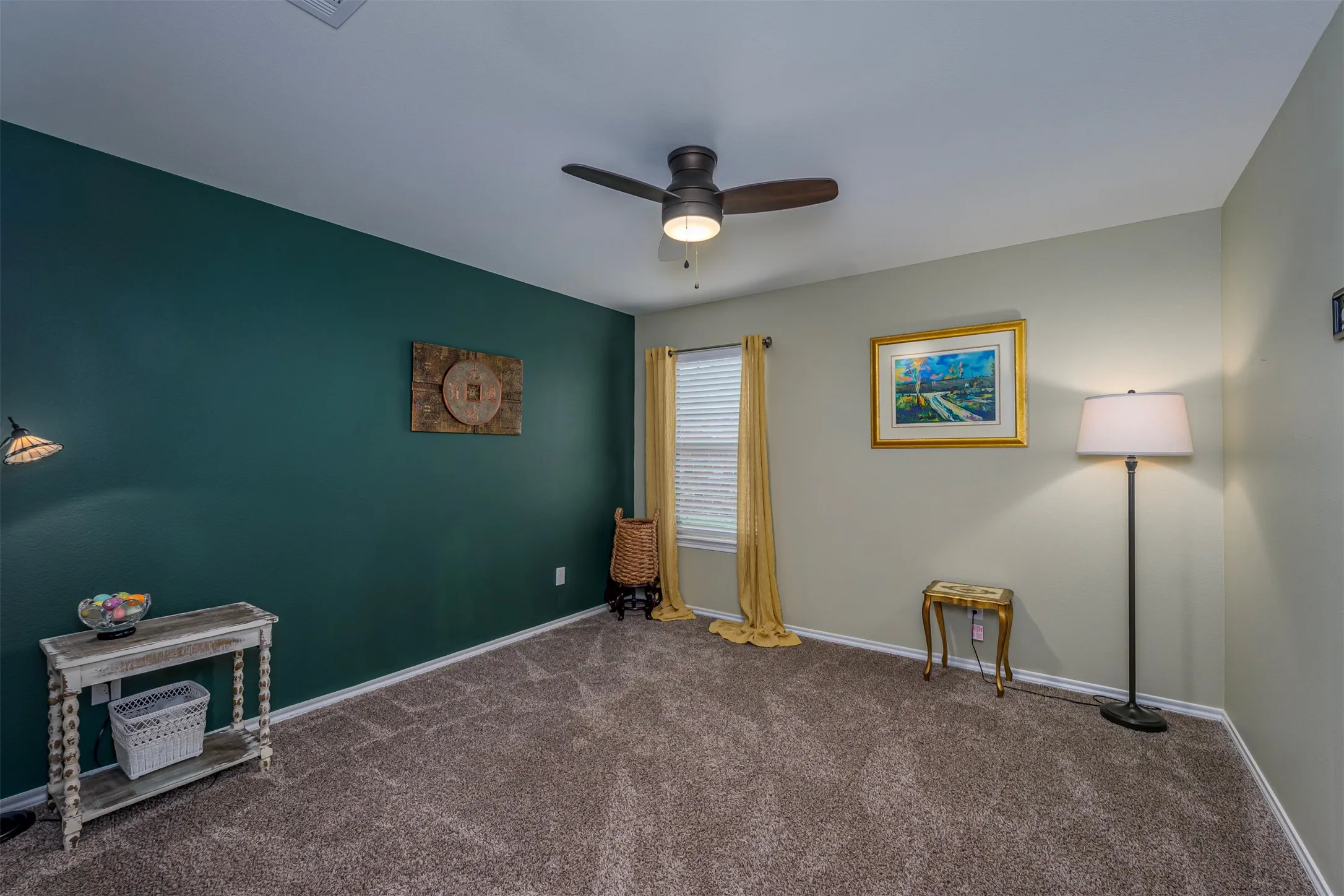 Ceiling fan with light fixture, window with blinds, and carpeted flooring