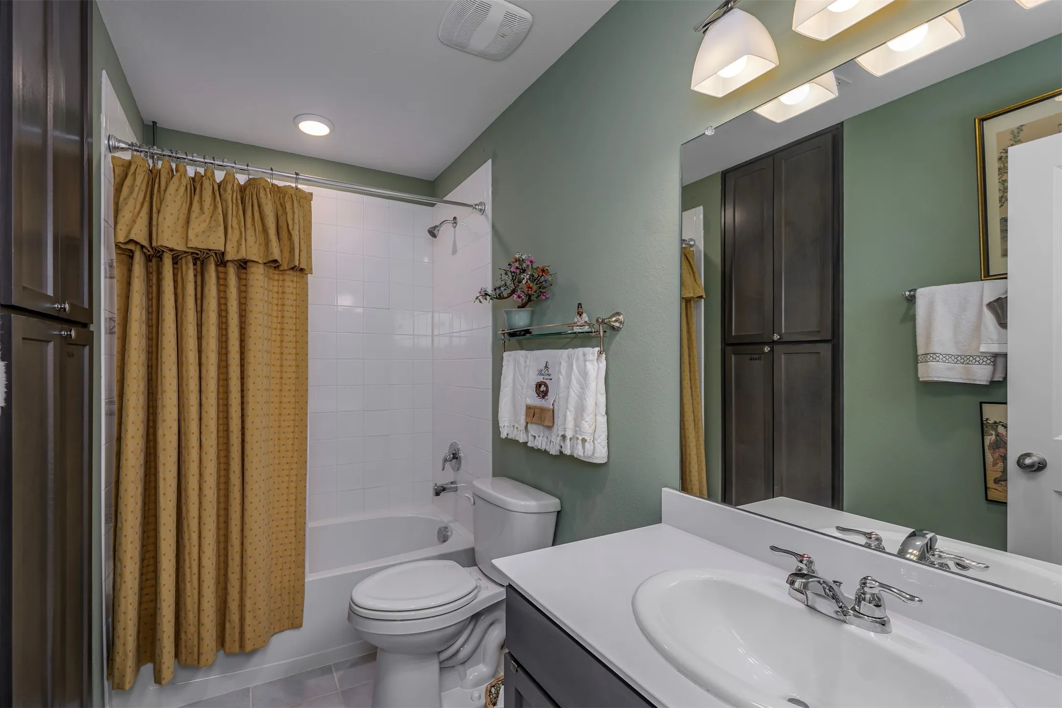 White tiled shower and tub combination