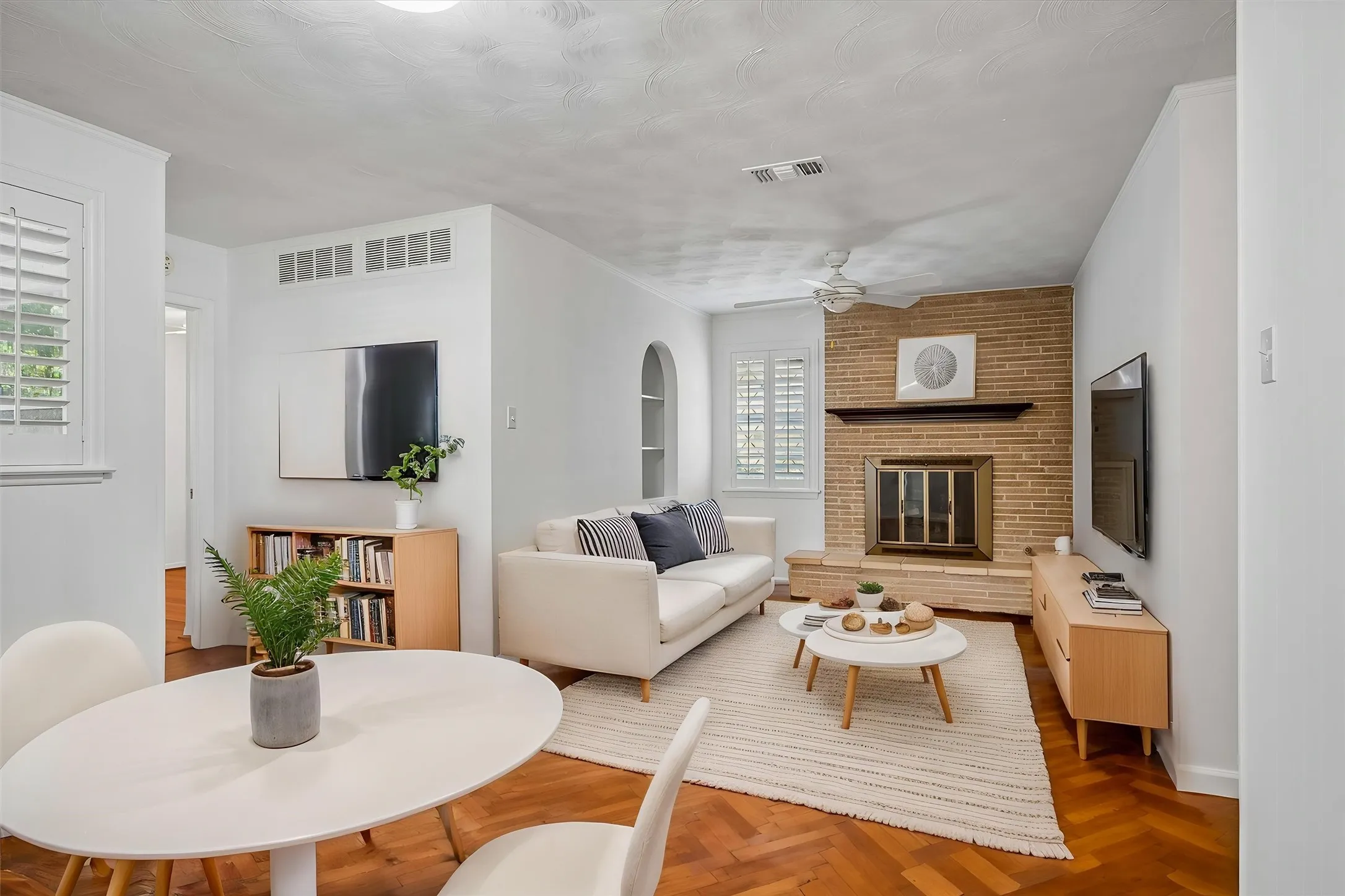 VIRTUALLY STAGED to show a second view of the charming family room