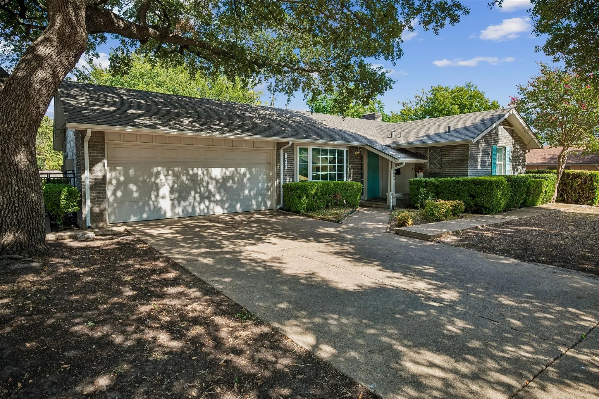This Irving charmer offers a brick exterior with gabled roofline, bay window and attached 2 car garage with storage room