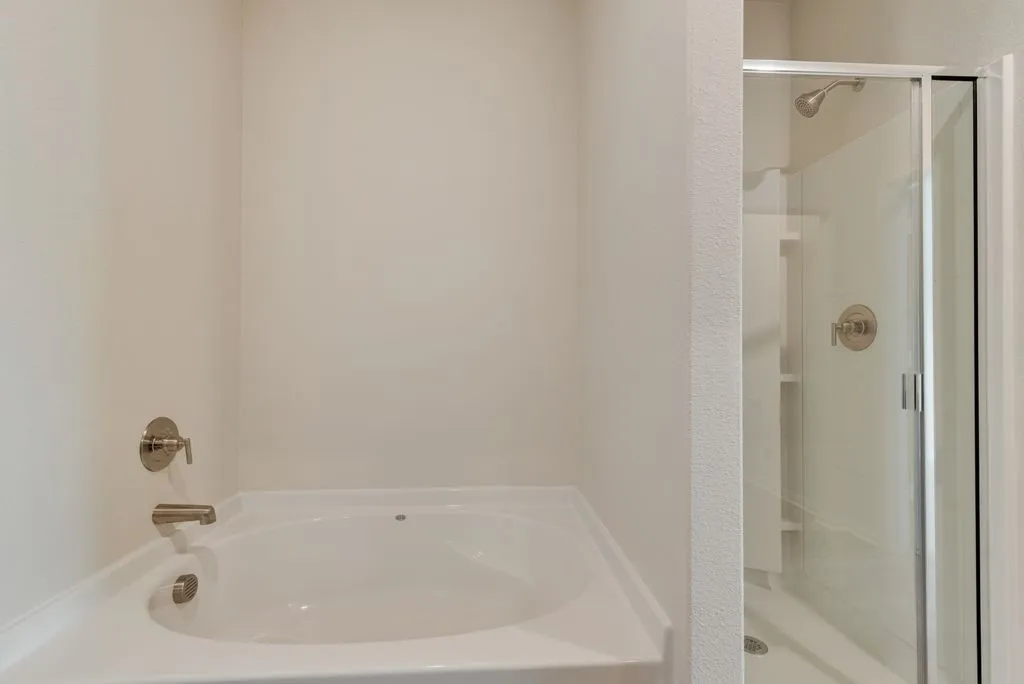 Built-in tub with brushed nickel fixtures
