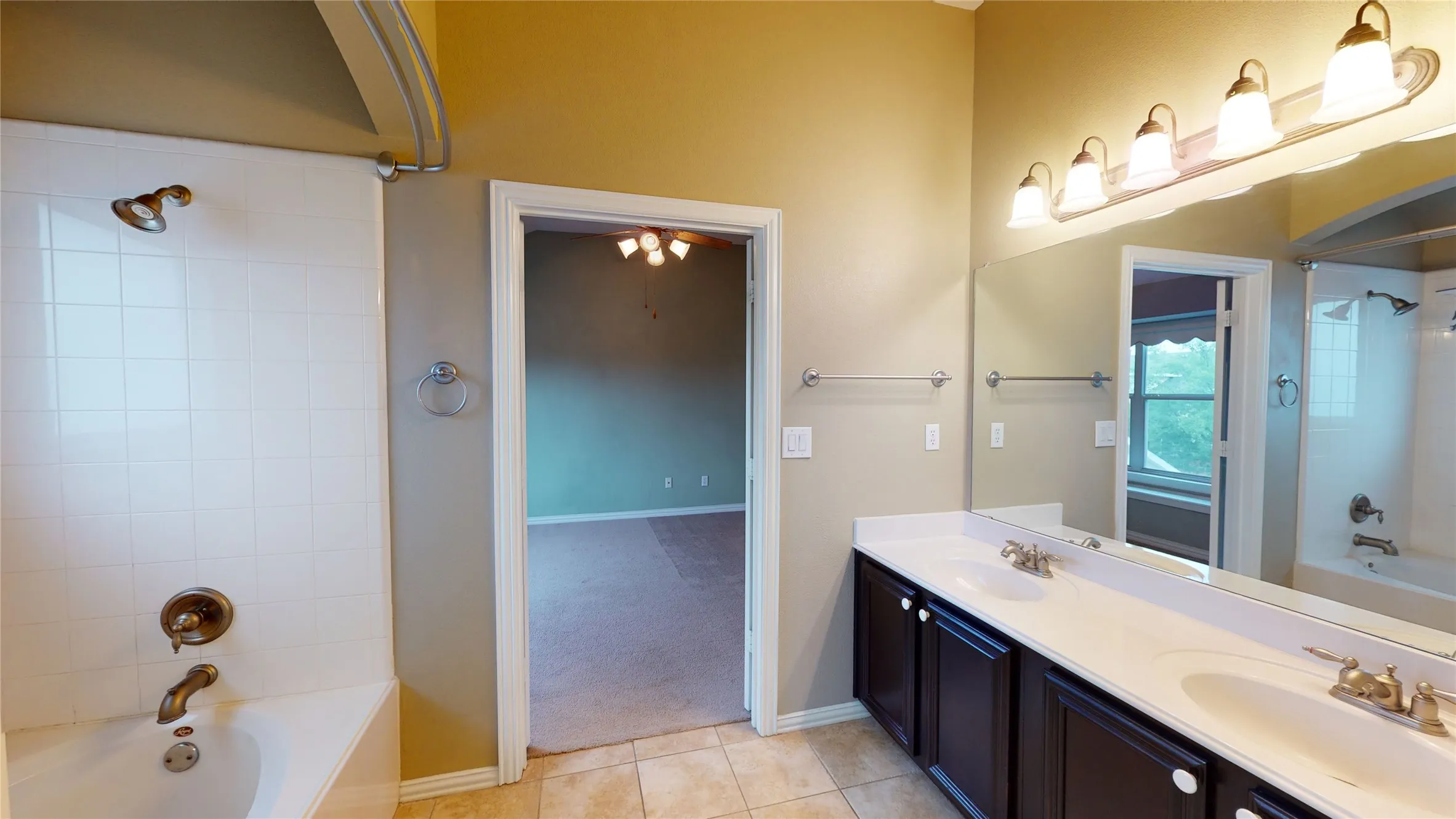 Tub and shower enclosure, dual sinks.