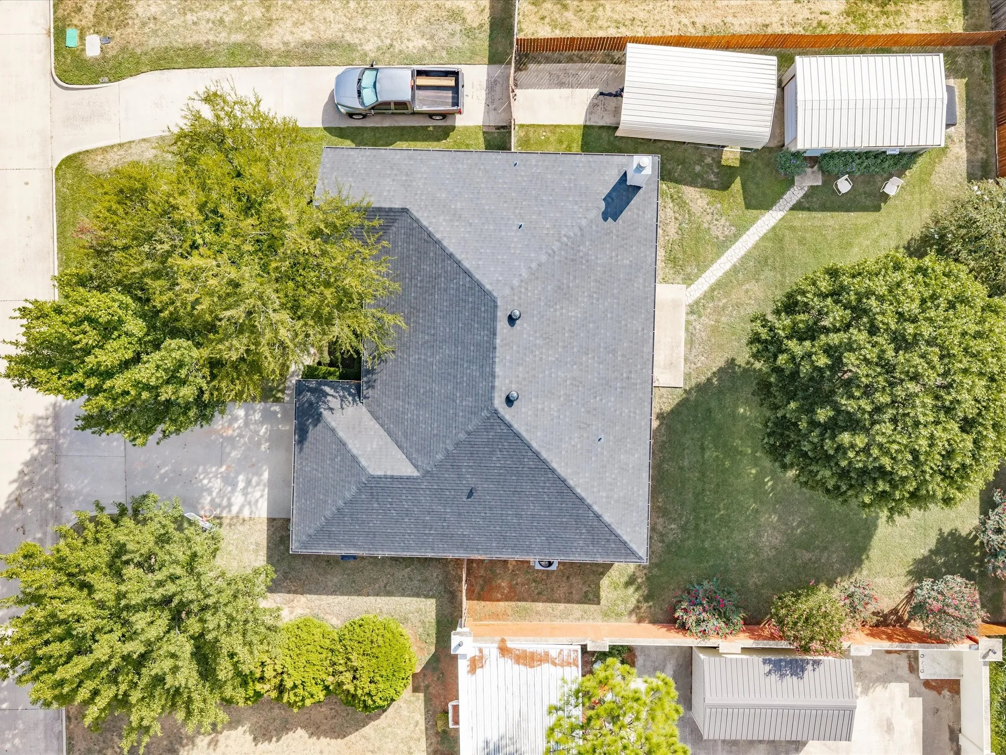 TWO DRIVEWAYS!!! One to the garage & one to the covered parking & hobby shop!
