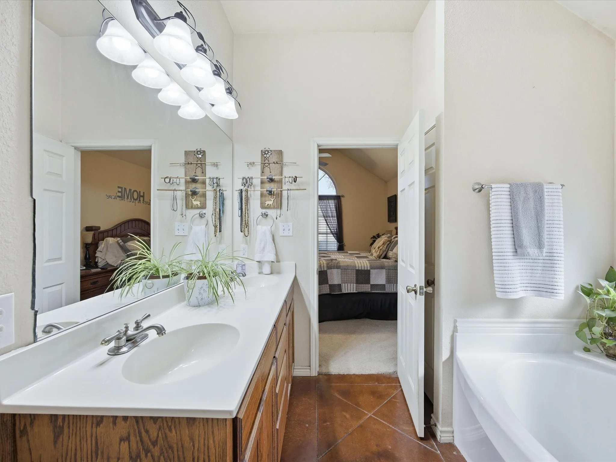 Primary bathroom with dual sinks, separate shower & a soaking tub