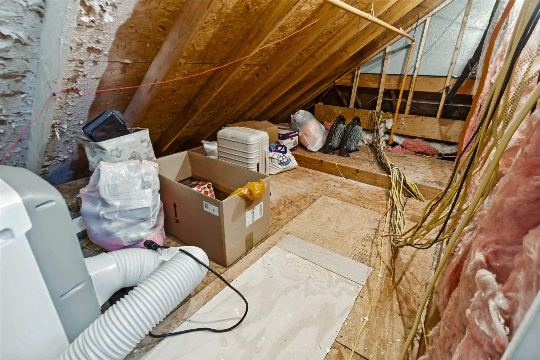 Walk out attic storage space through secondary bedroom closet