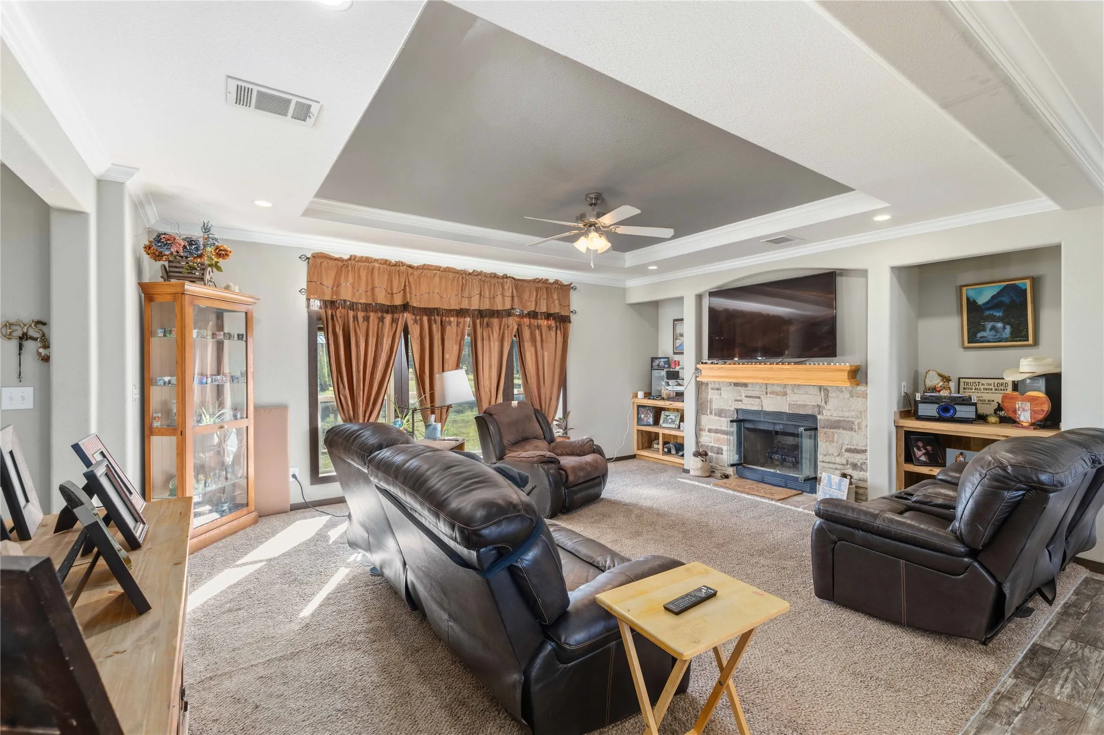 Tray ceiling with recessed lighting and crown molding