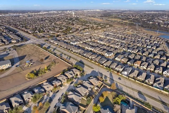 Residential development featuring single-family homes and a dedicated playground area