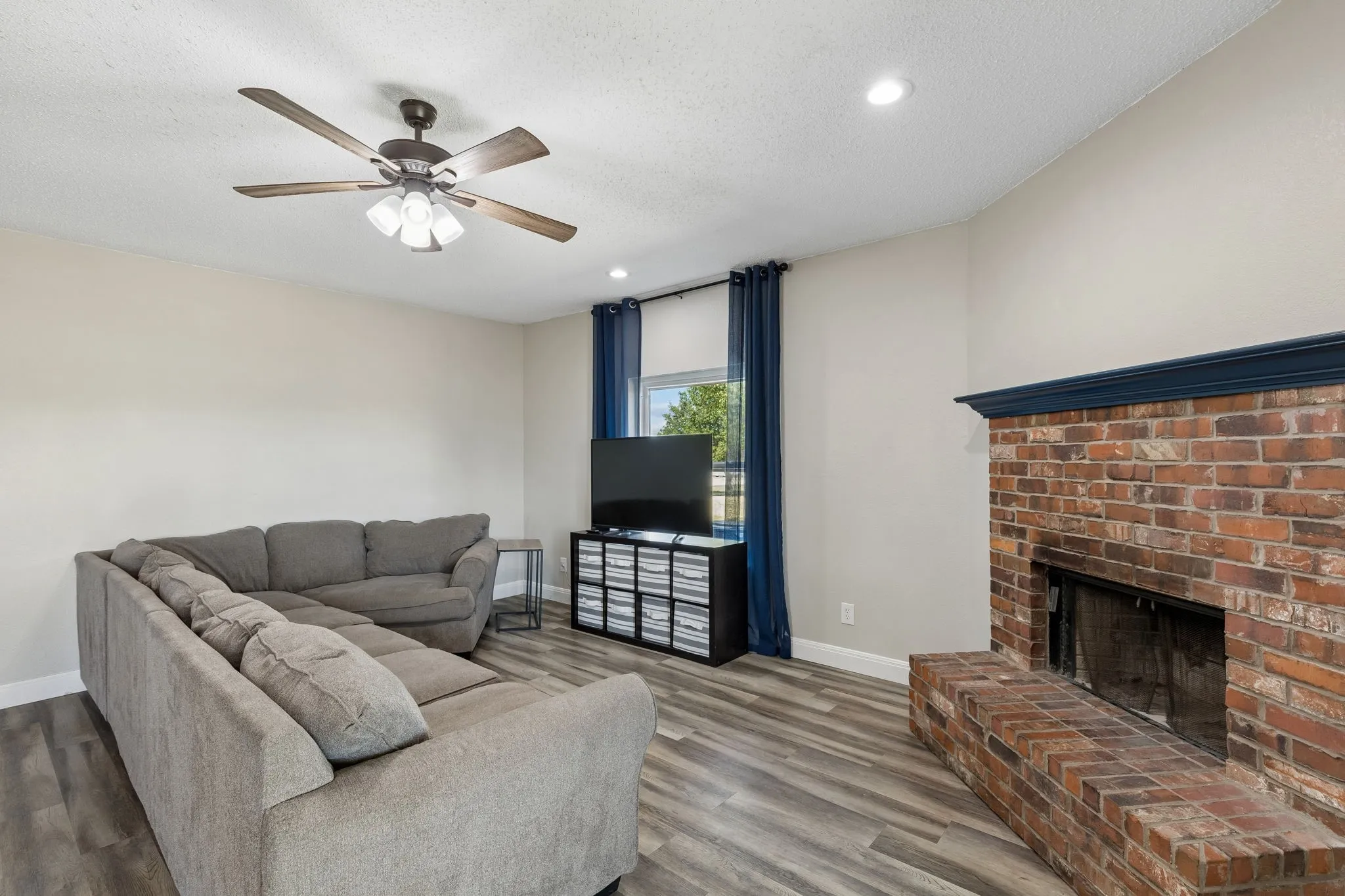 Brick fireplace with a painted mantel