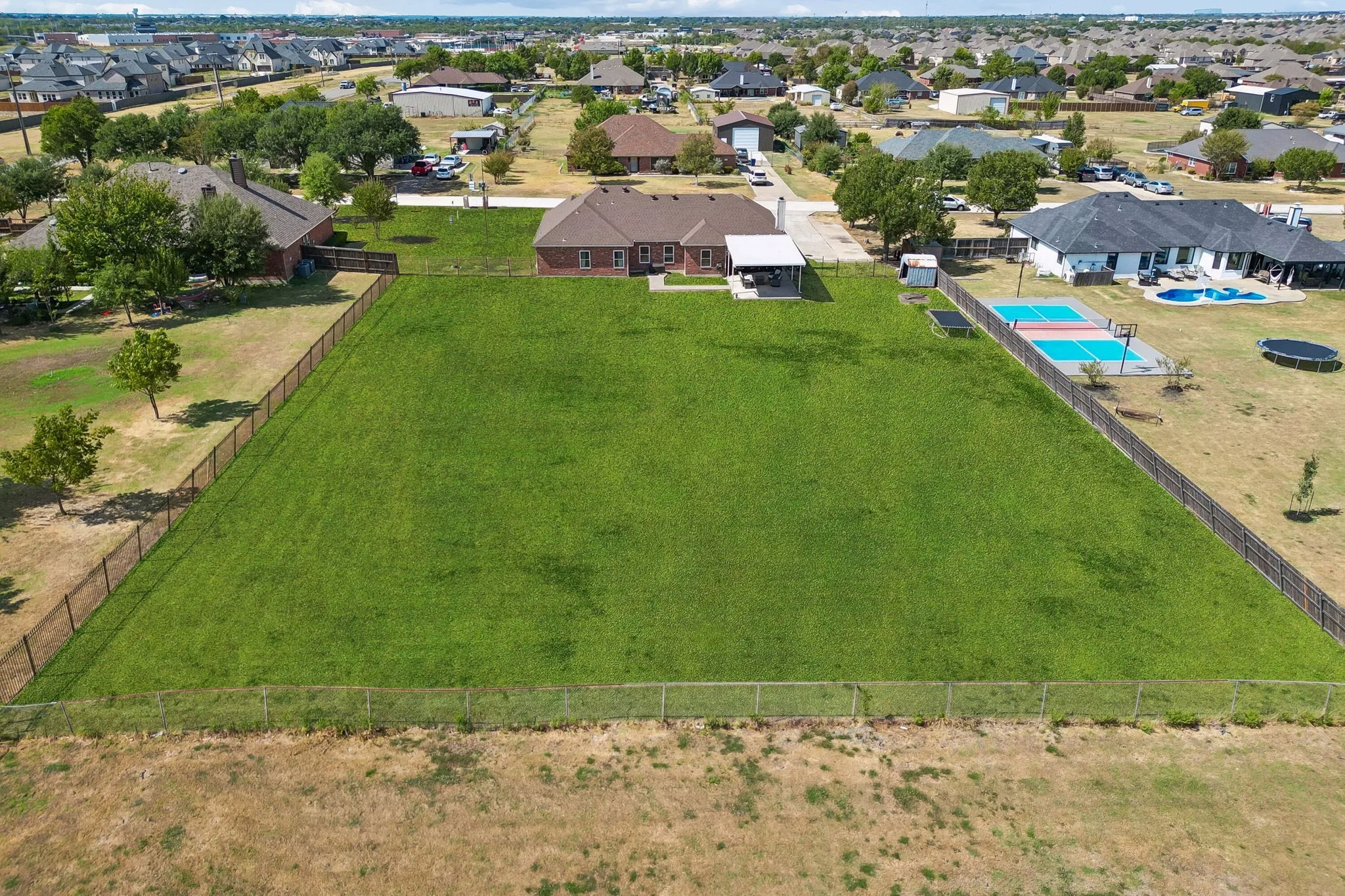Expansive space with perimeter fencing