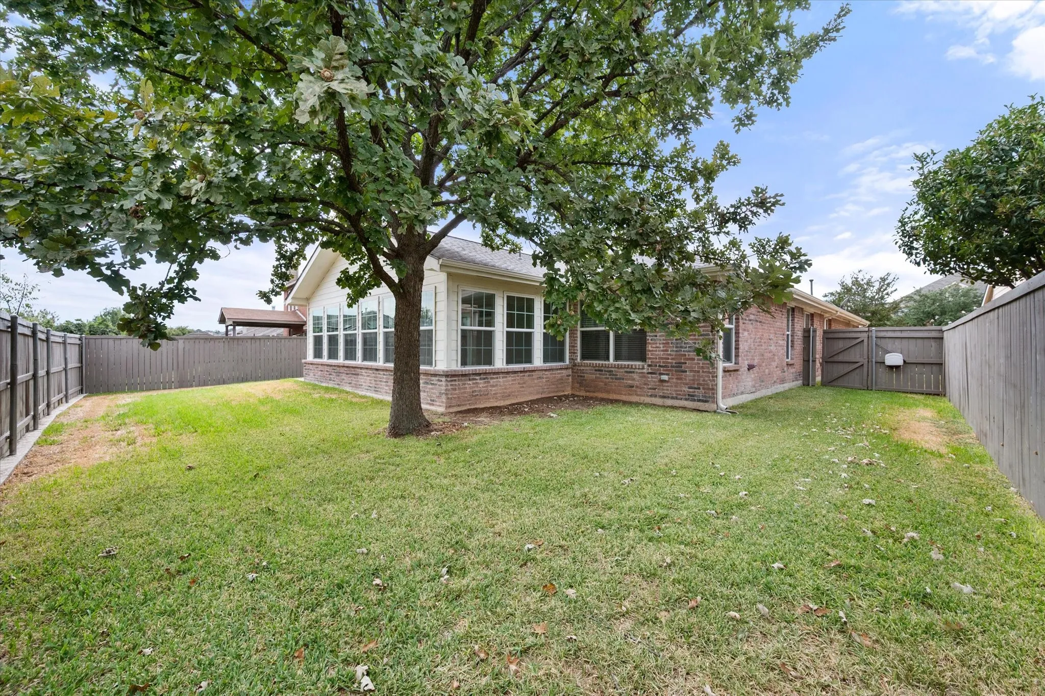 Private backyard with plenty of space for family to play and pets to roam