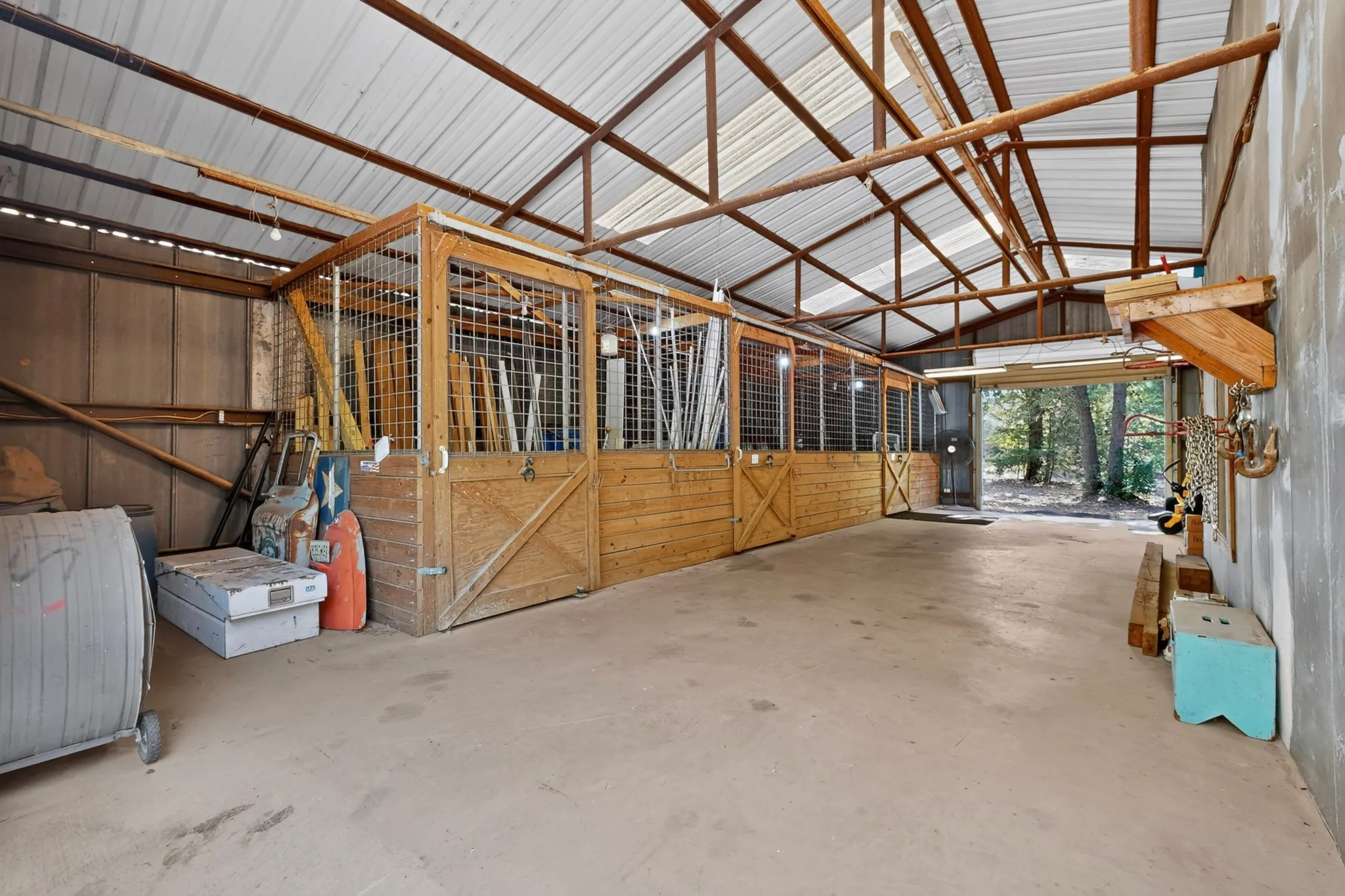 36x48 Barn with 3 stalls and Tack Room. 2 Overhead Doors. Seperate Elec Meter