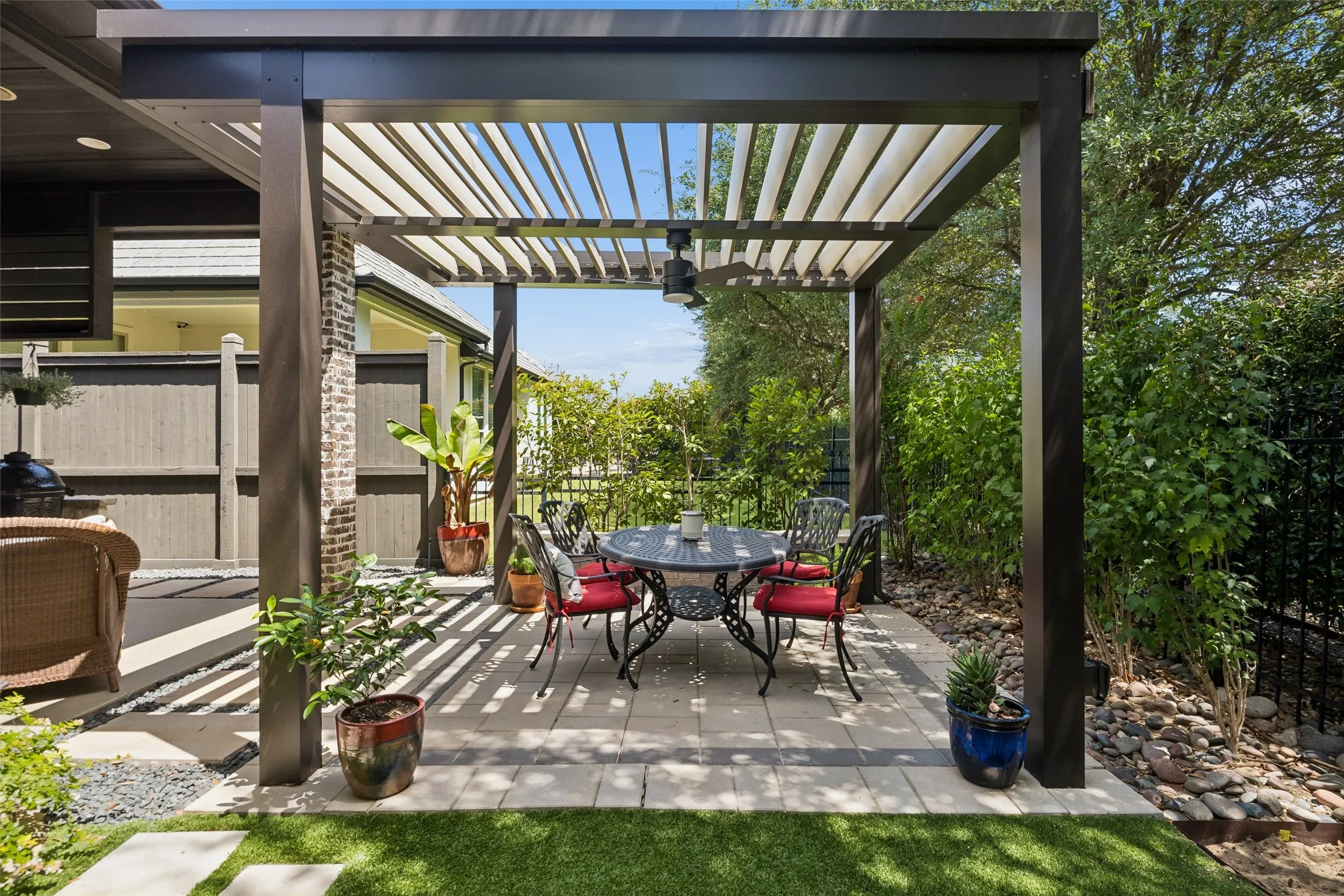 Low maintenance  motorized, lighted  pergola.