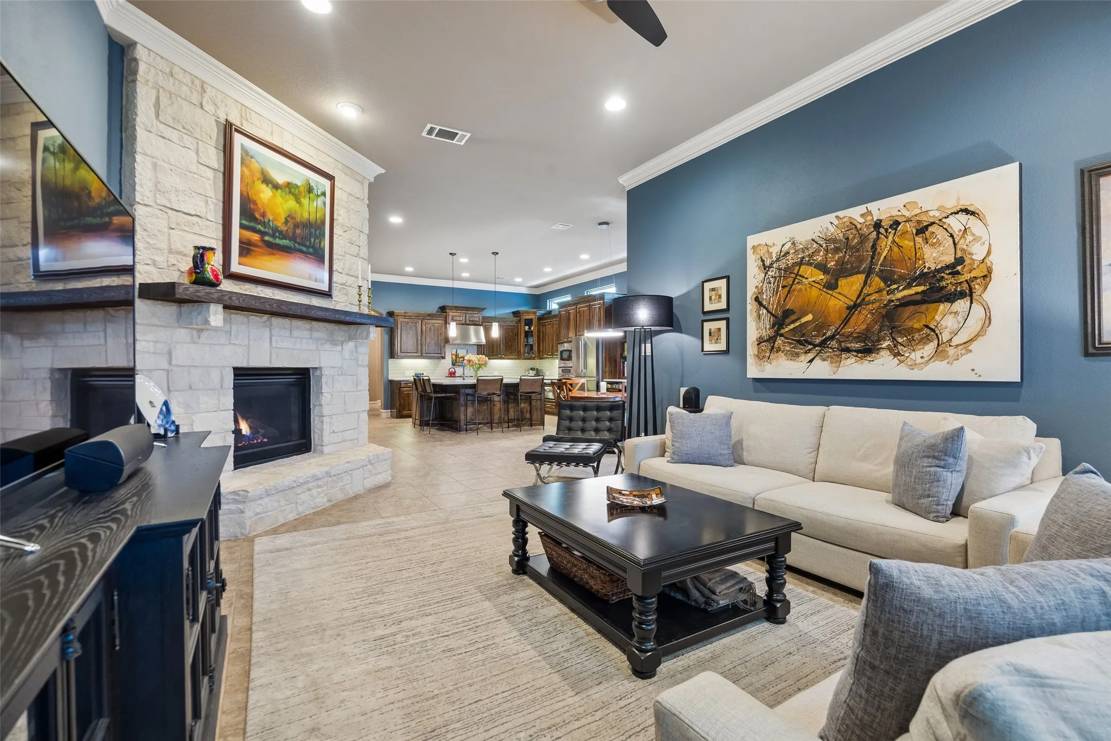 Gorgeous stone gas fireplace.