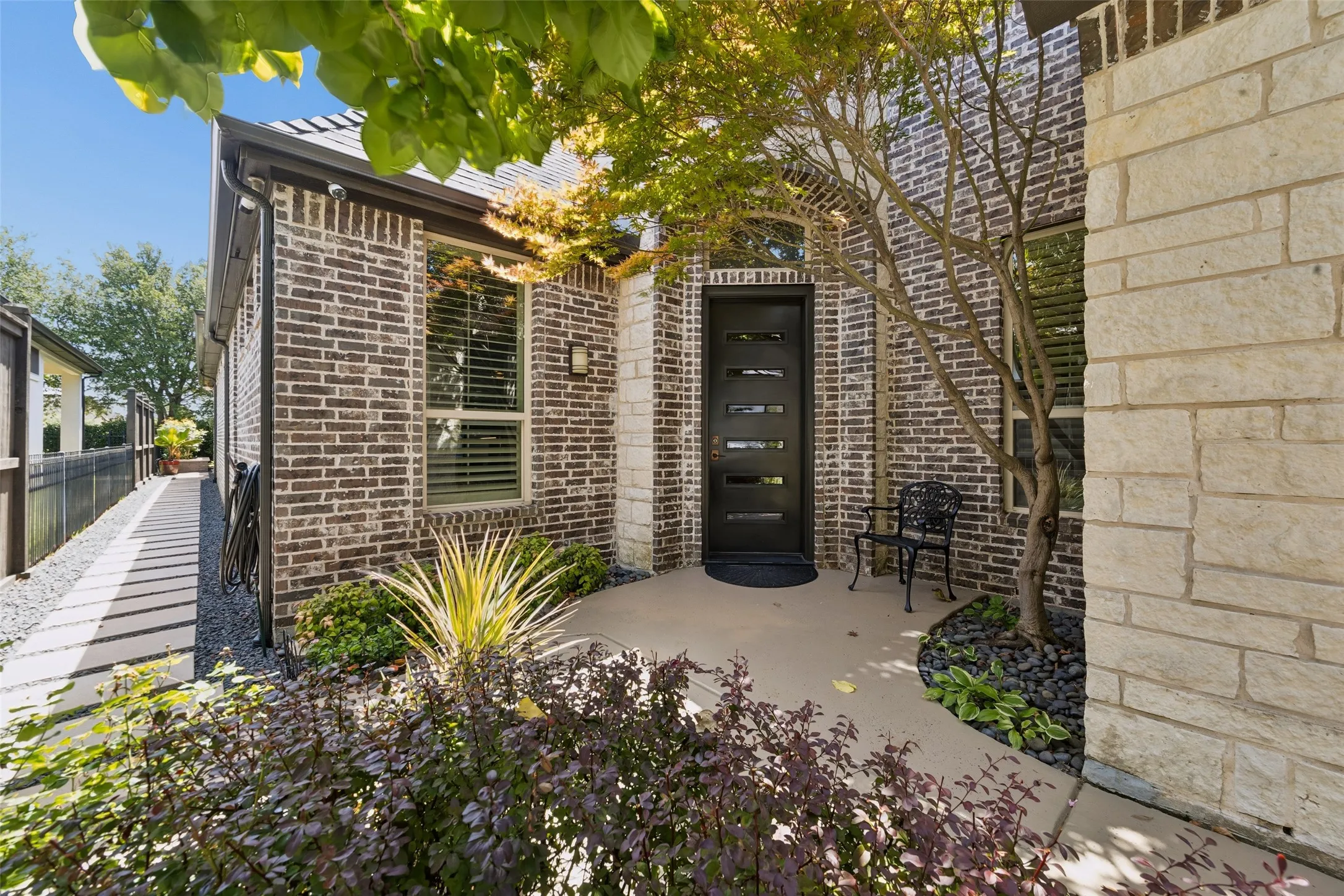 Gated, front courtyard entry.