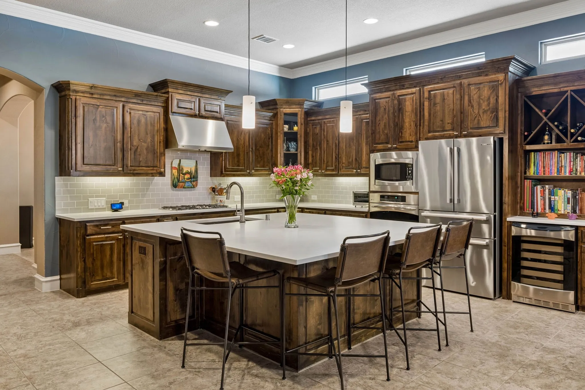 Centerpiece Island, Ground Granite sink with touchless faucet, Bosch Refrigerator, warming drawer & Wine Cooler create the perfect space for entertaining.