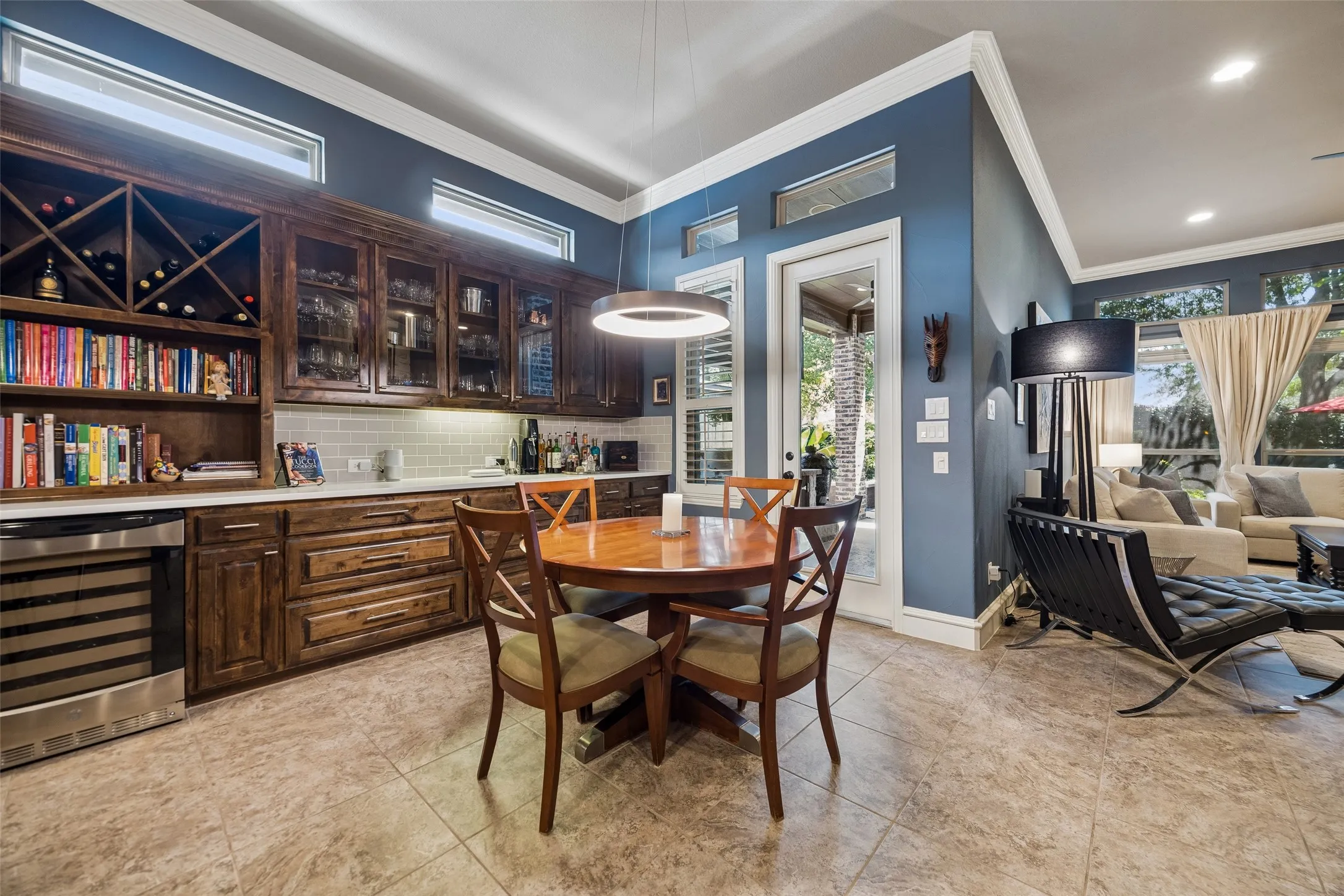 Additional seating and a Bar or coffee area with glass cabinet inserts.
